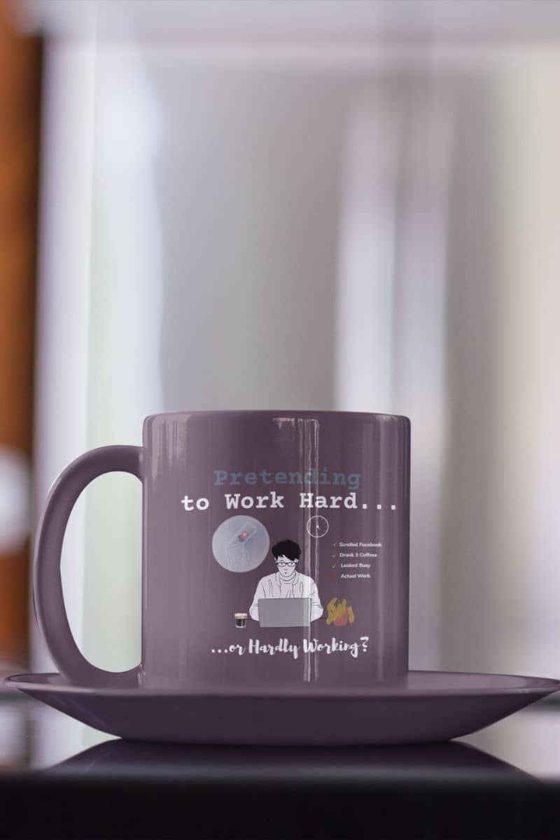 Work from home coffee cup with a purple cup close up next to the coffee pot