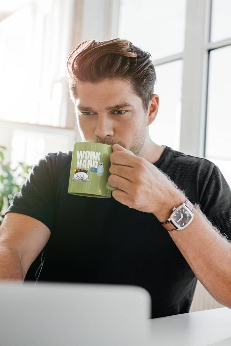 Work hard, nap harder mug with the guy drinking a cup of coffee while working on his laptop