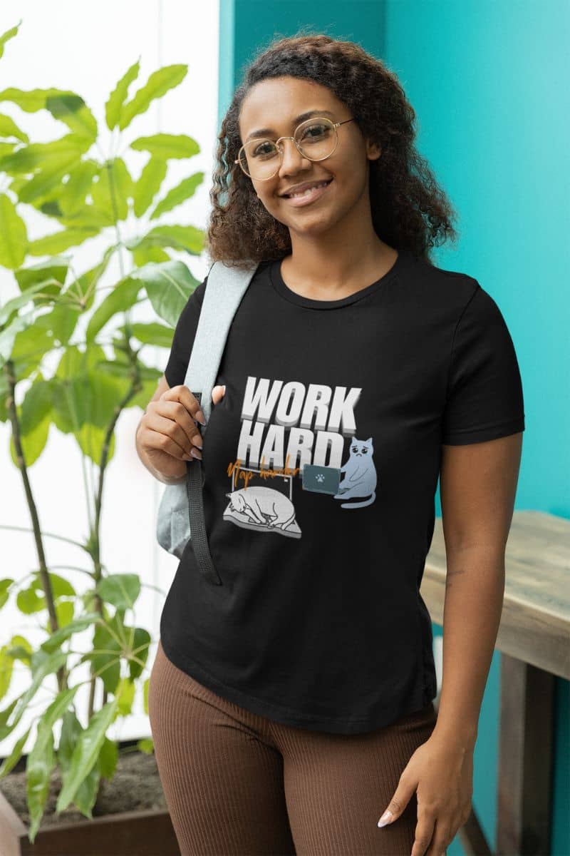 Work hard, nap harder t-shirt with a girl standing posing on the balcony with a backpack on her shoulder