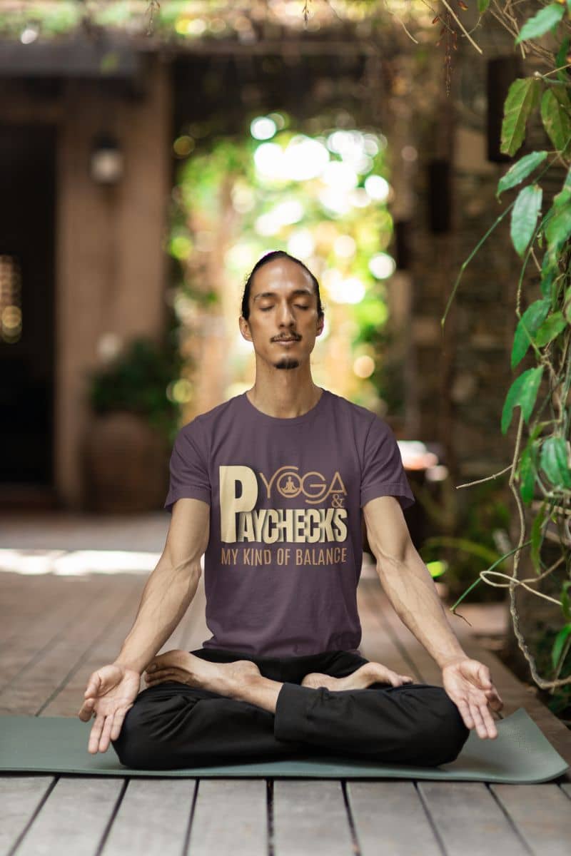 Yoga and paychecks t-shirt with a man meditating in the yard