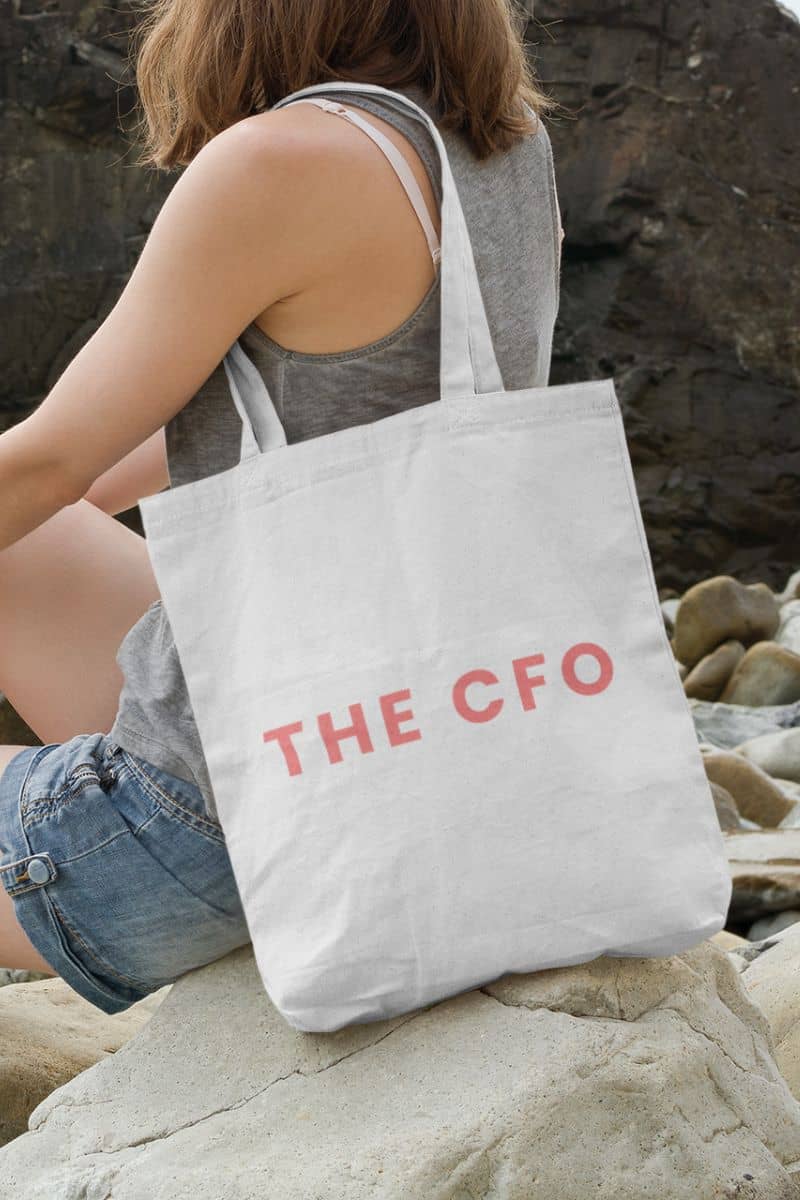 casual everyday tote with a person sitting on rocks with a tote bag labeled 'THE CFO'