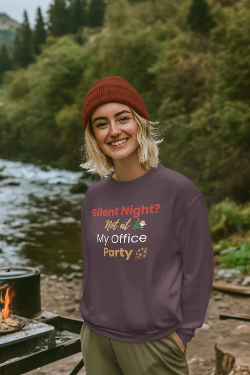 christmas office sweater with a person wearing a sweatshirt with text 'Silent Night? Not at My Office Party' in a forest setting