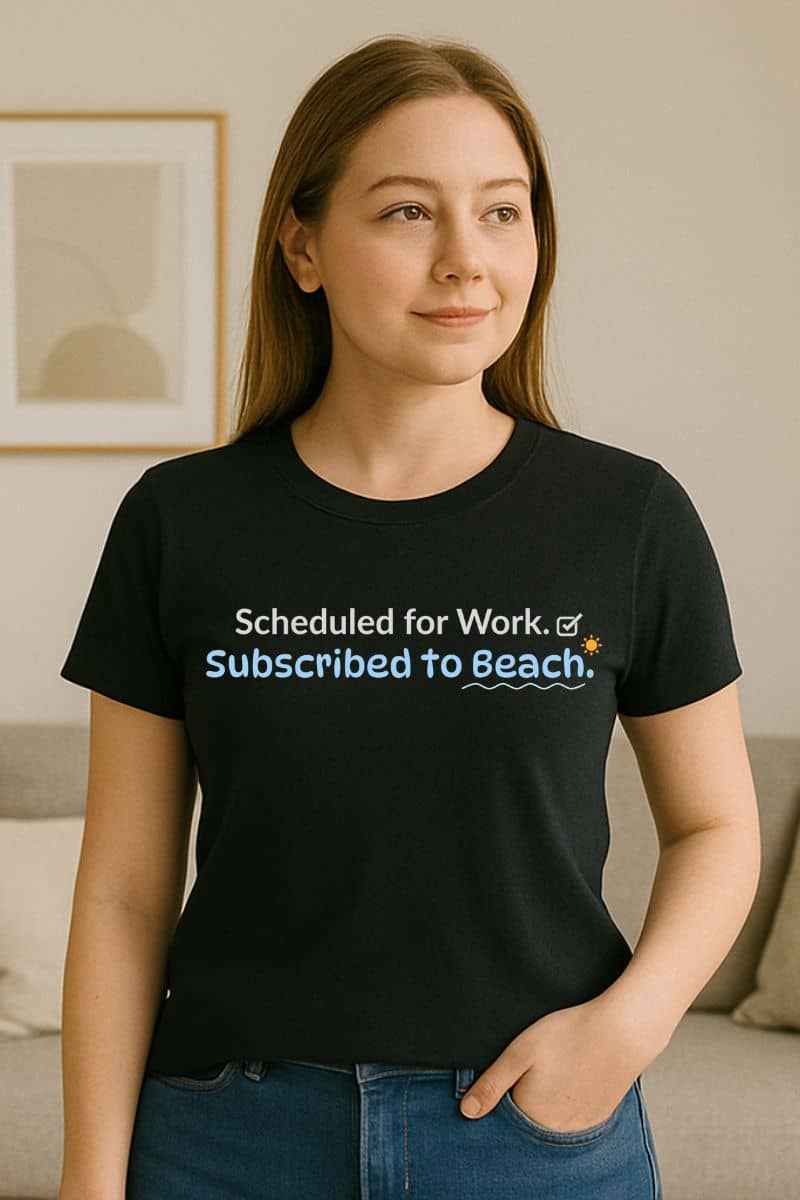 family vacation t-shirts with a woman wearing a black t-shirt with 'Scheduled for work. Subscribed to beach.'