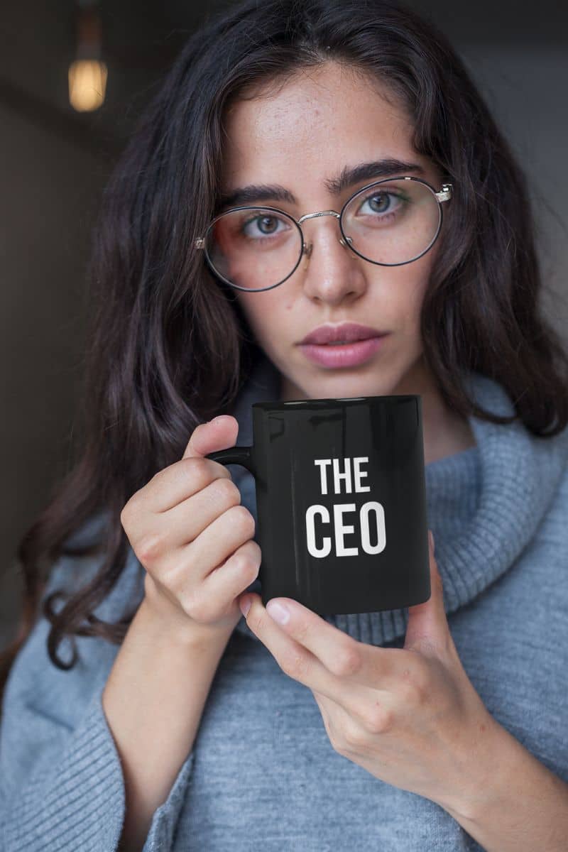 funny coffee mug for husband with a woman holding a black mug with 'THE CEO' text