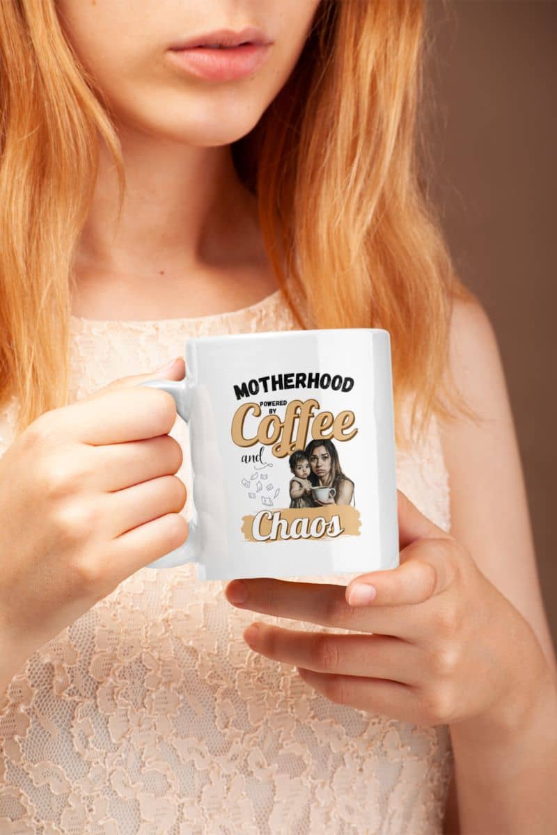 funny mom gift coffee cup with a person holding a mug with text 'Motherhood Powered by Coffee and Chaos'