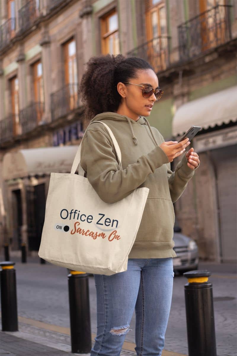 funny zen gift for coworkers with a woman holding a tote bag with 'Office Zen' text on a city street.