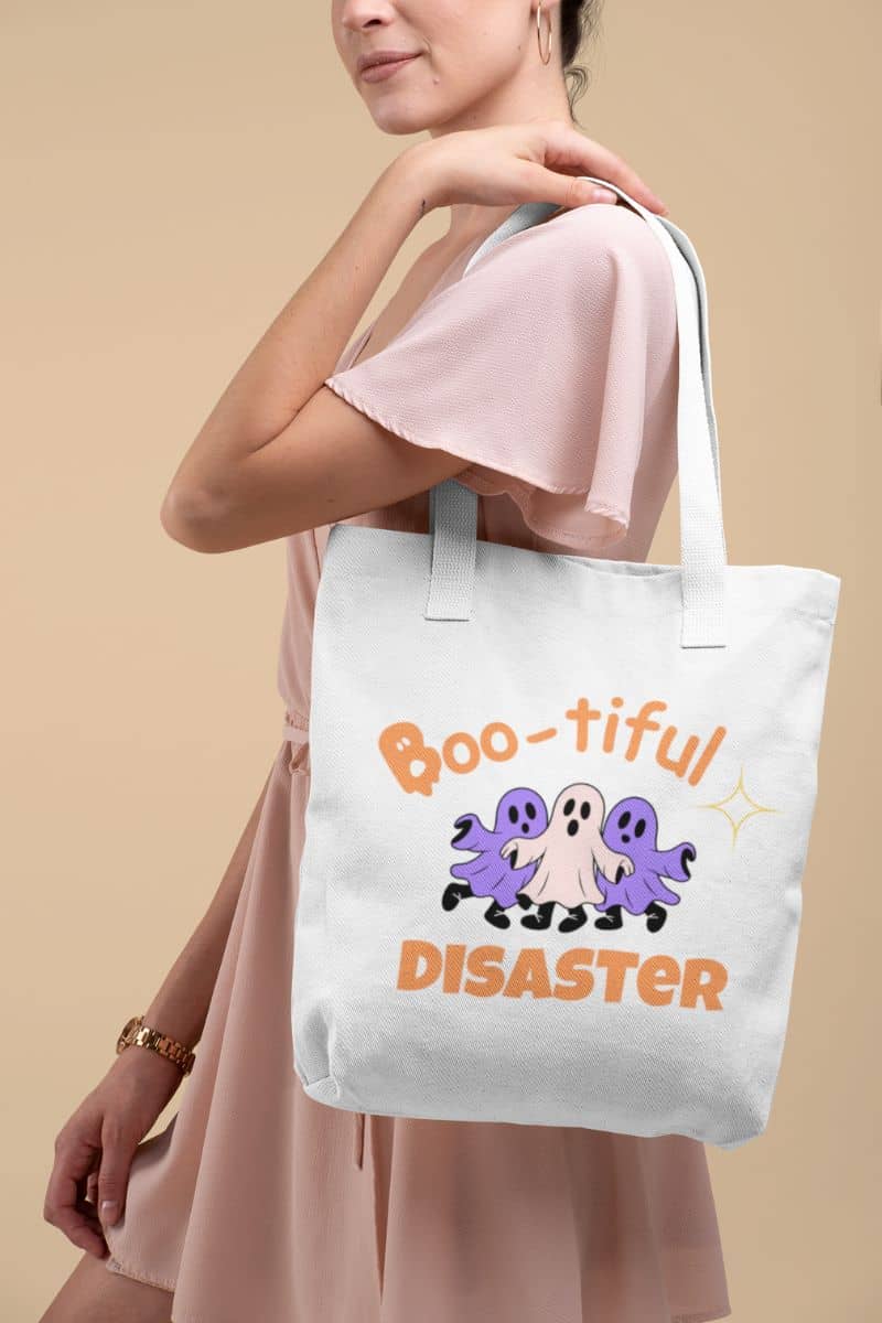 halloween trick or treat bag with a girl holding a tote bag with Halloween-themed design on a beige background