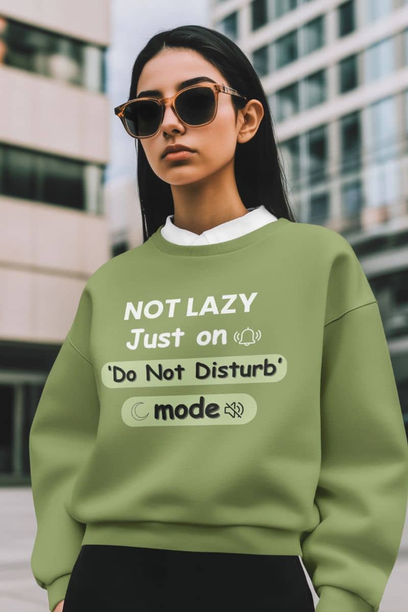 quiet person tote with a woman wearing a green sweatshirt with text in an urban setting