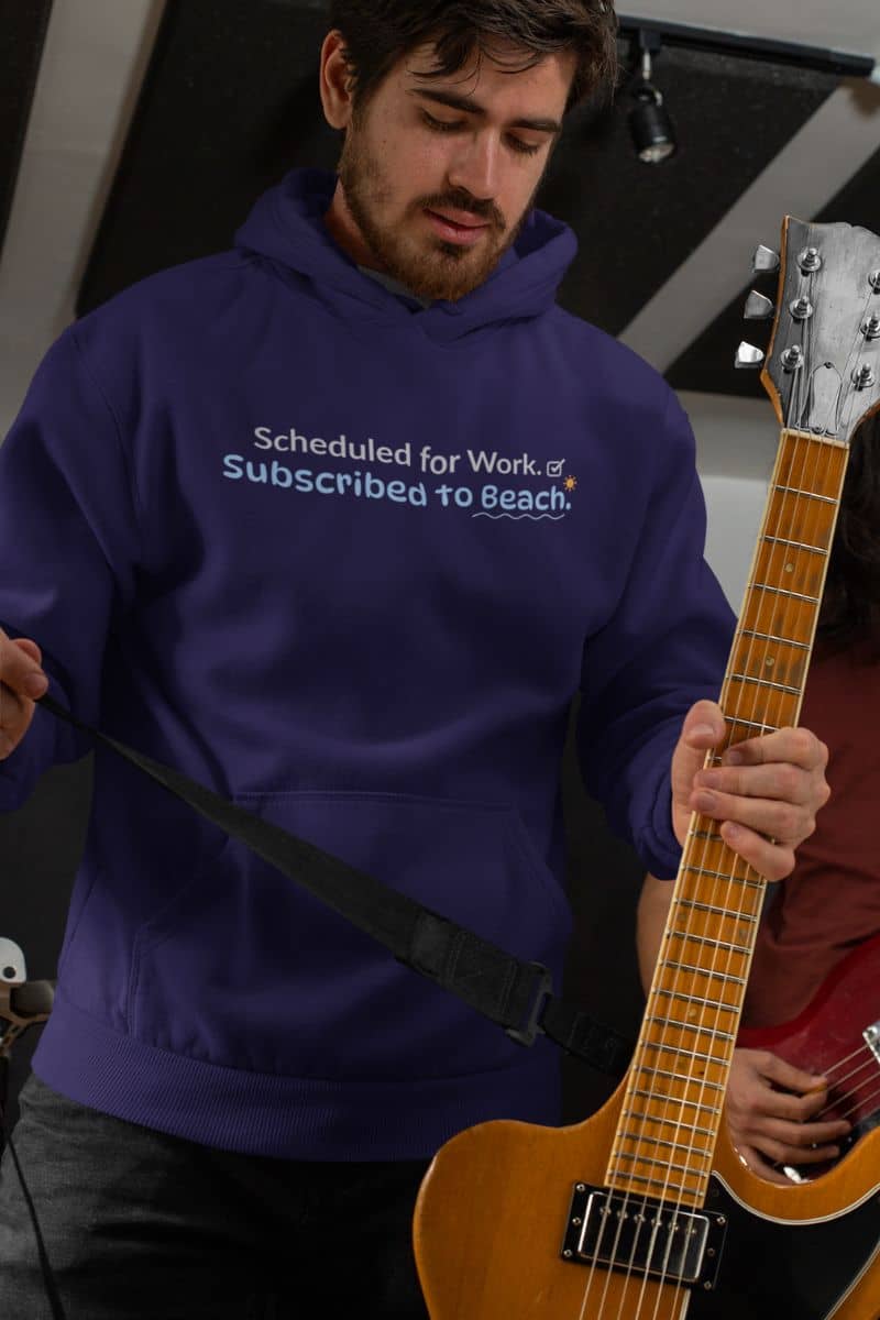 sarcastic beach hoodie with a person in  a blue hoodie with text 'Scheduled for Work. Subscribed to Beach' holding a guitar