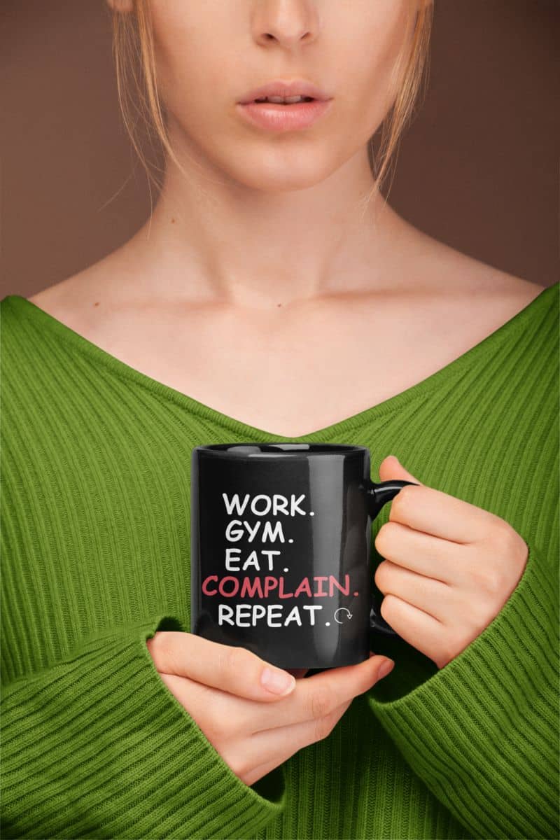 work from home coffee cup with a girl in a green shirt holding a mug with text 'Work. Gym. Eat. Complain. Repeat'