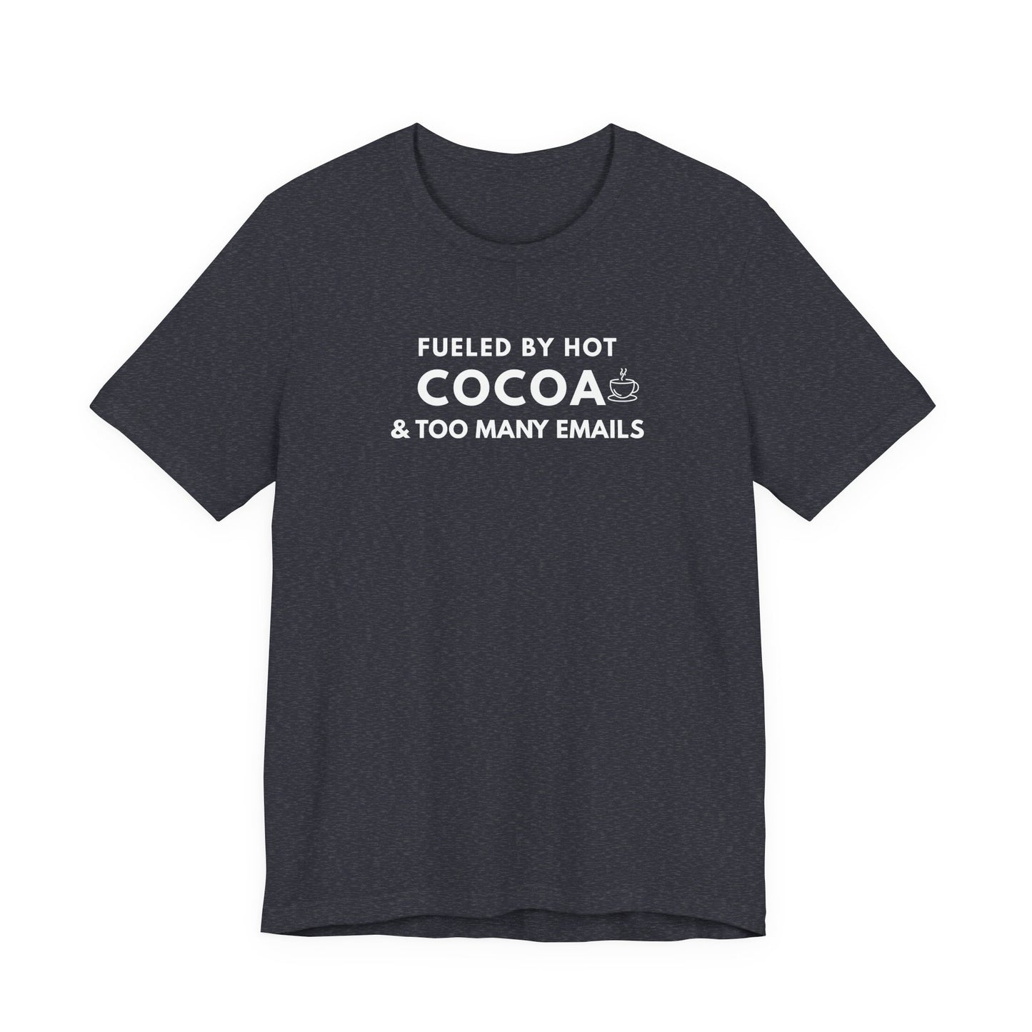 Dark gray t-shirt with white text 'Fueled by hot cocoa & too many emails' on a white background
