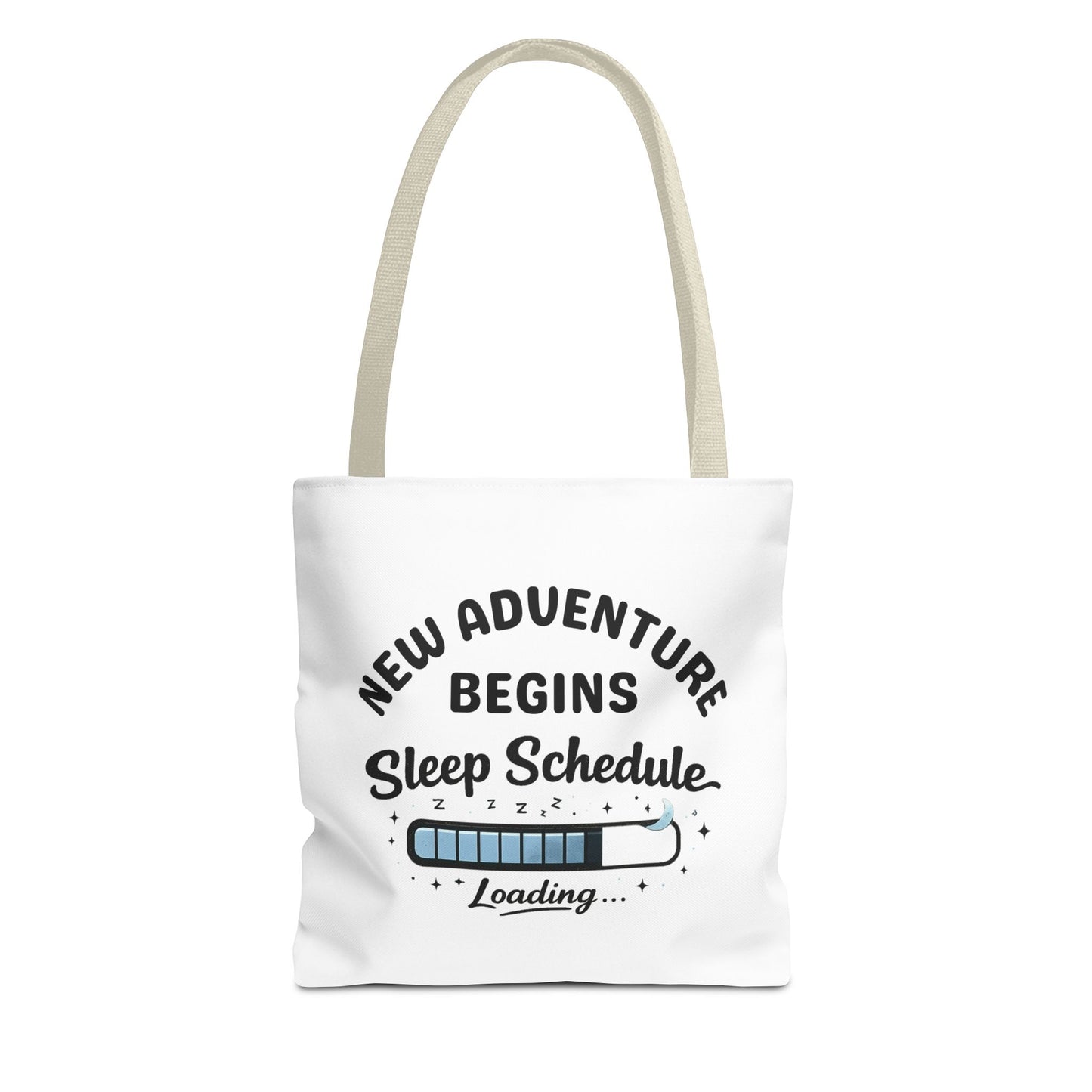 Tote bag with beige handle and 'New Adventure Begins Sleep Schedule Loading' text on a white background