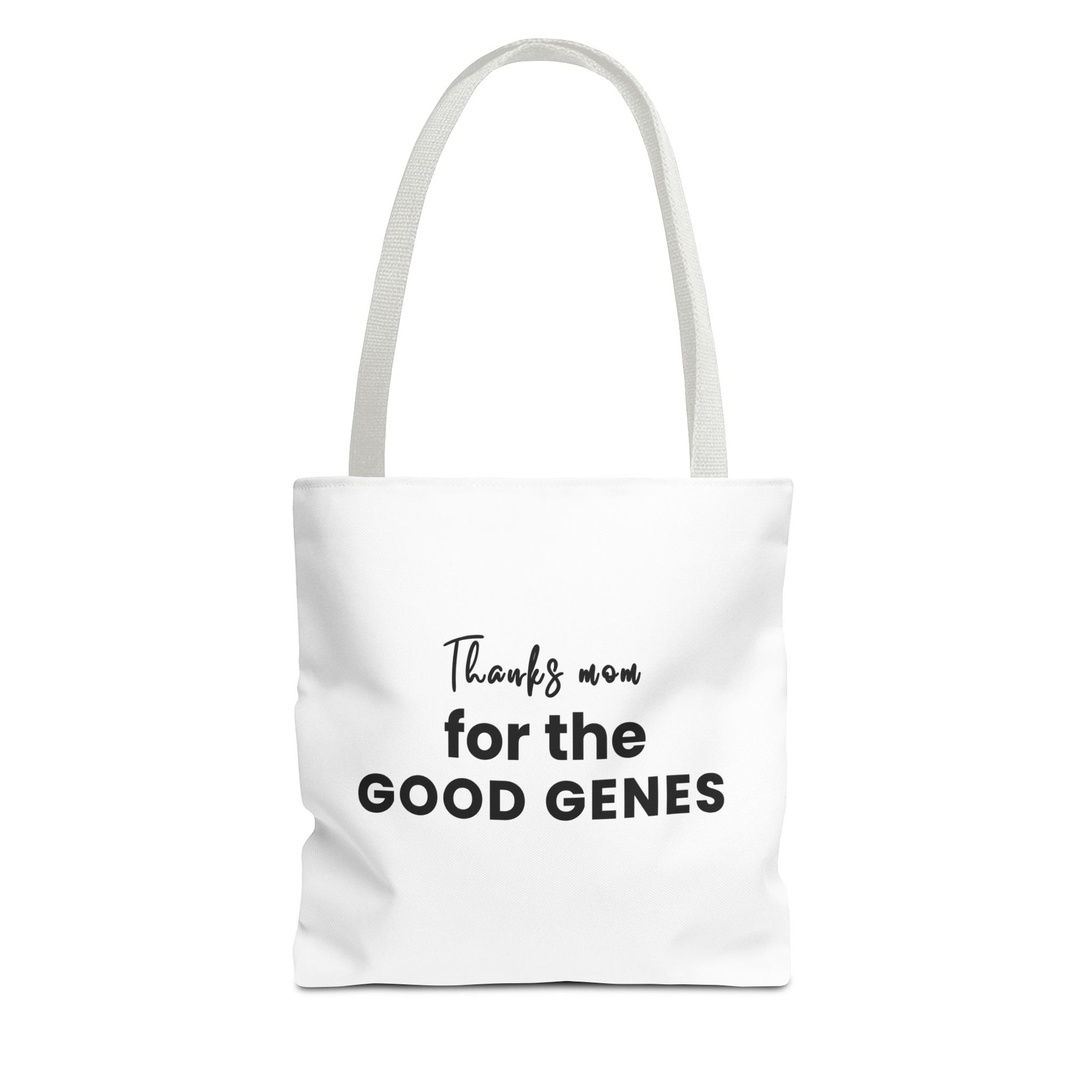 Tote bag with white handles and text 'Thanks Mom for the Good Genes' on a white background