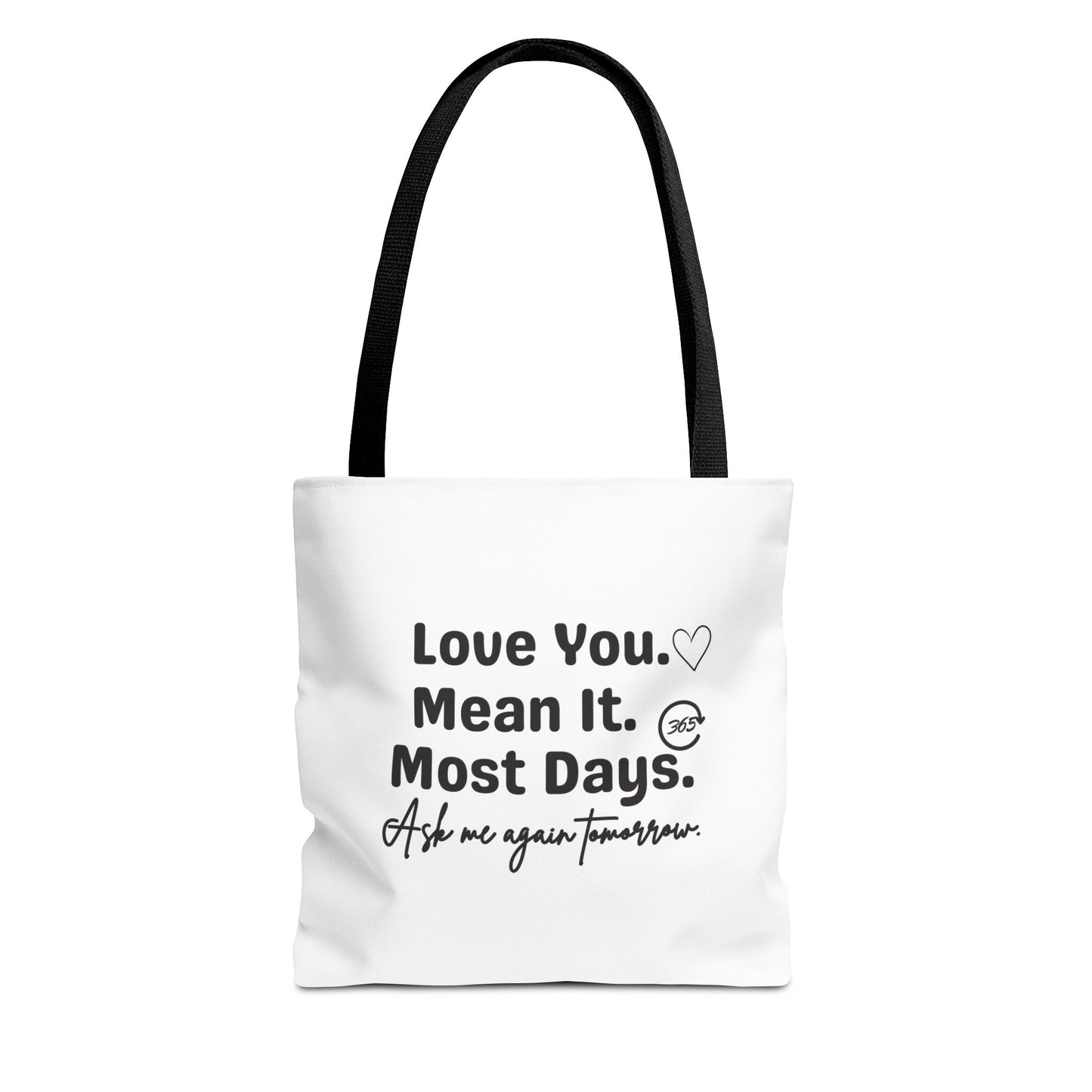 White tote bag with black handle and text 'Love You. Mean It. Most Days. Ask me again tomorrow.' on a white background