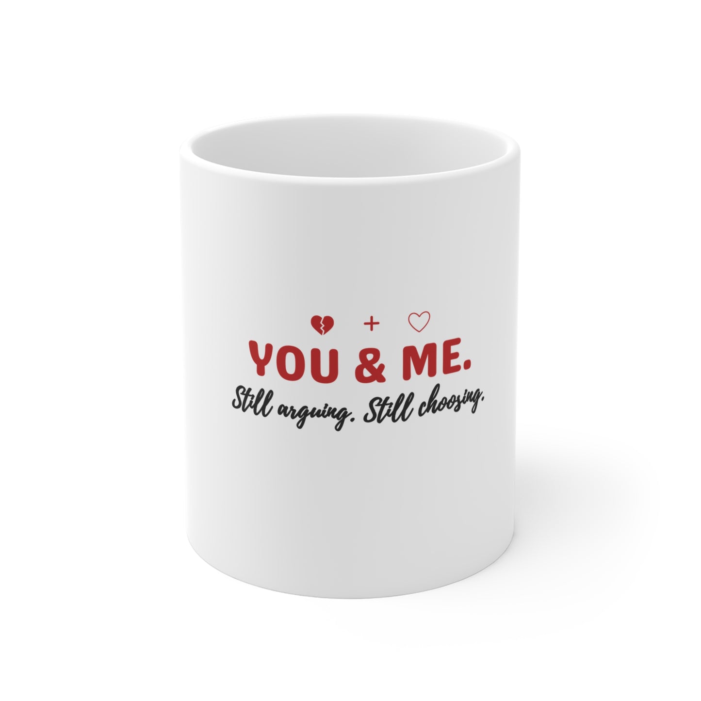 White mug with text 'YOU & ME. Still arguing. Still choosing.' on a white background