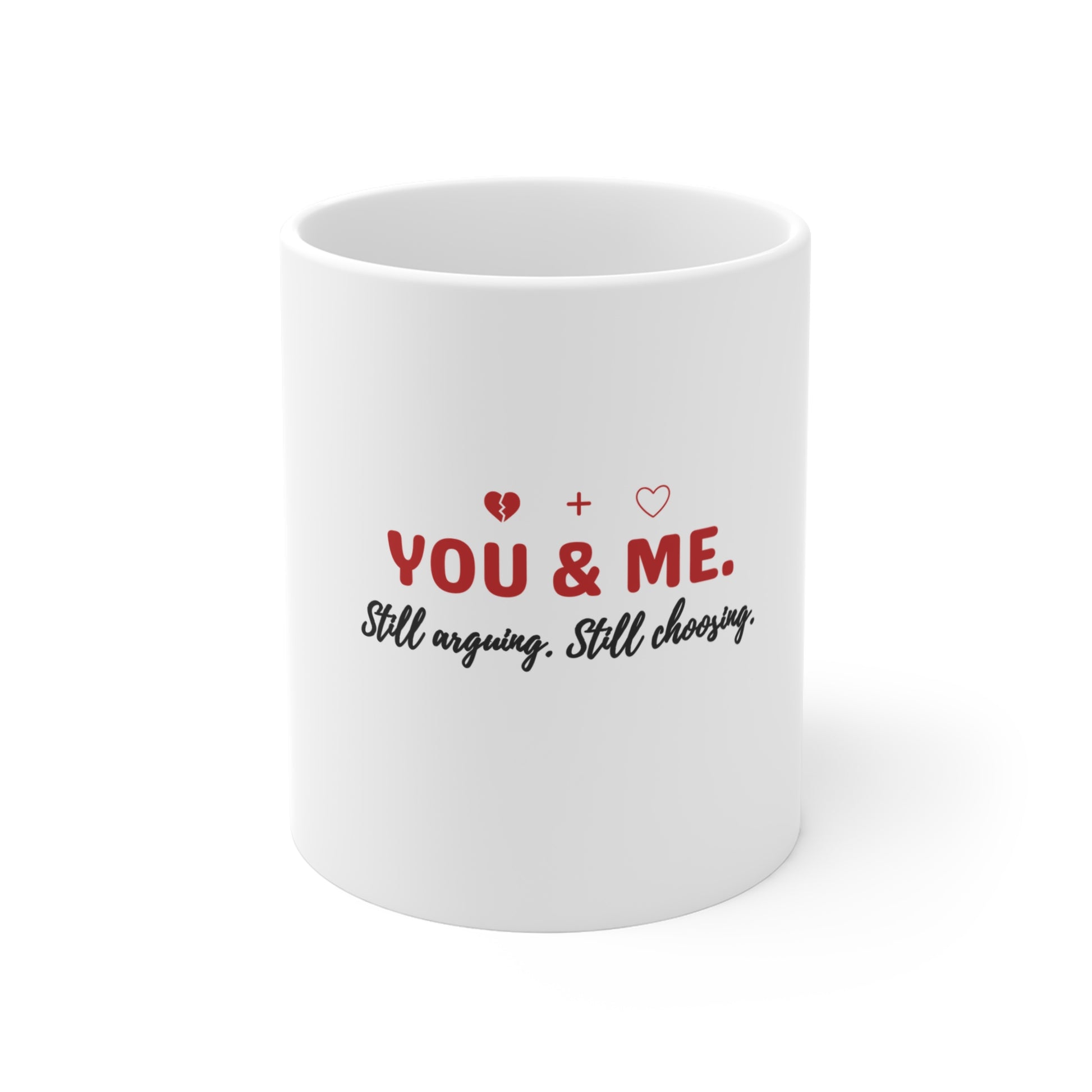 White mug with text 'YOU & ME. Still arguing. Still choosing.' on a white background