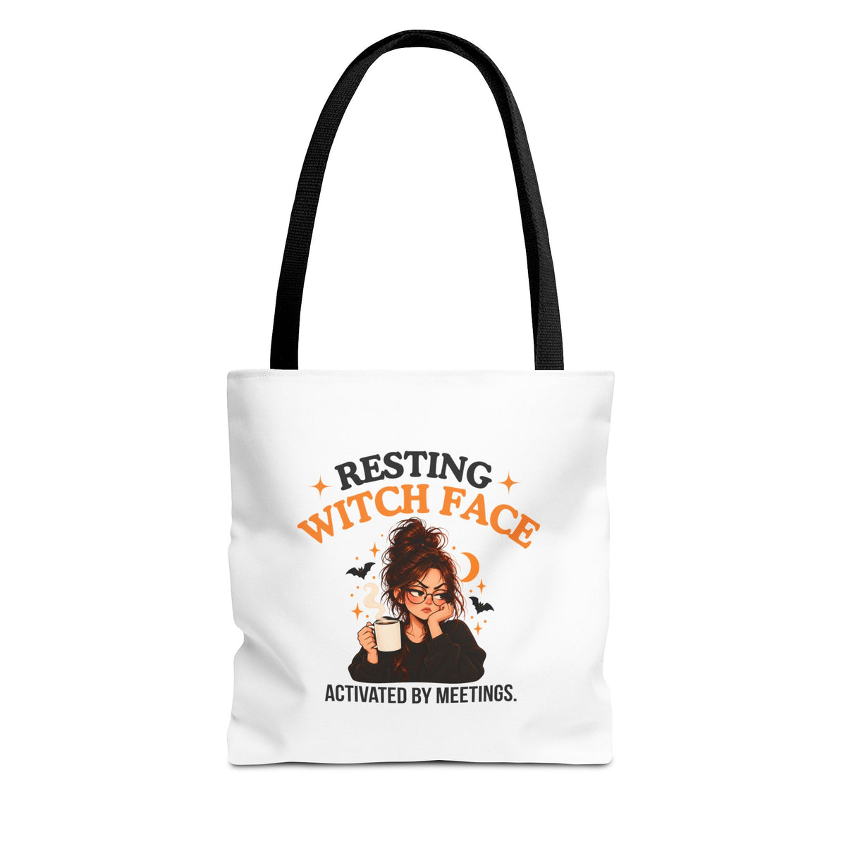 A white canvas tote bag with black shoulder straps, featuring a cartoon witch graphic and the text 'Resting Witch Face. Activated by Meetings.' on a plain white background.
