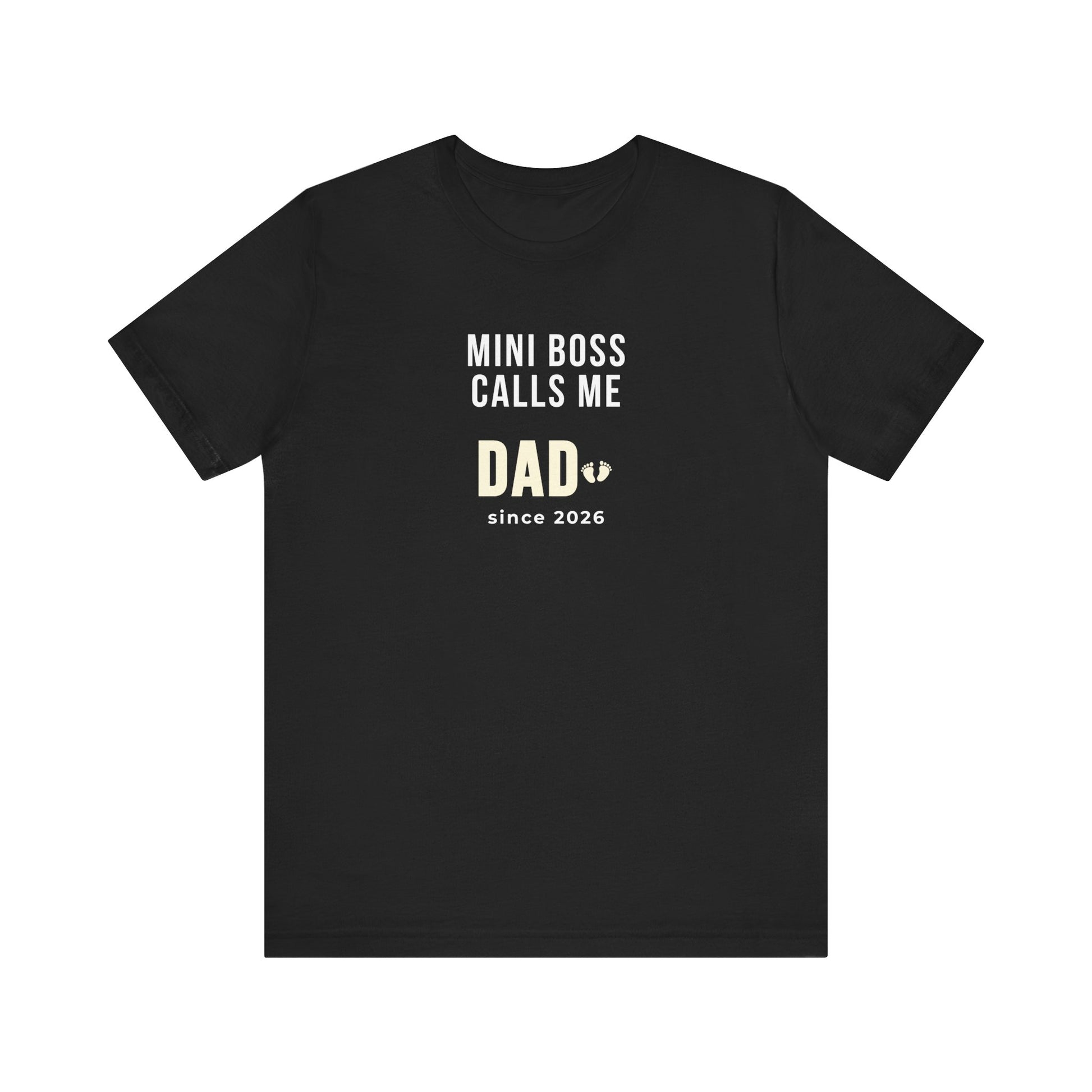 Black t-shirt with white text 'Mini Boss Calls Me Dad – since 2026' on a white background