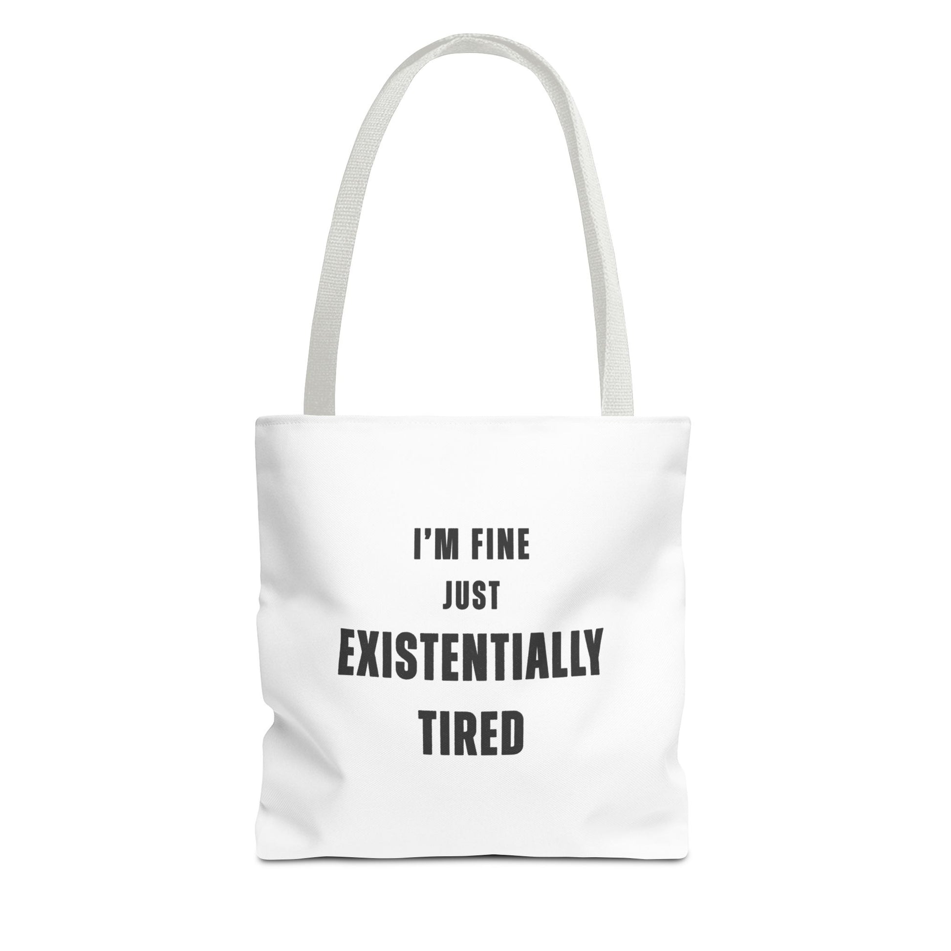 White tote bag with white handles and text 'I’m fine. Just existentially tired.' on a white background