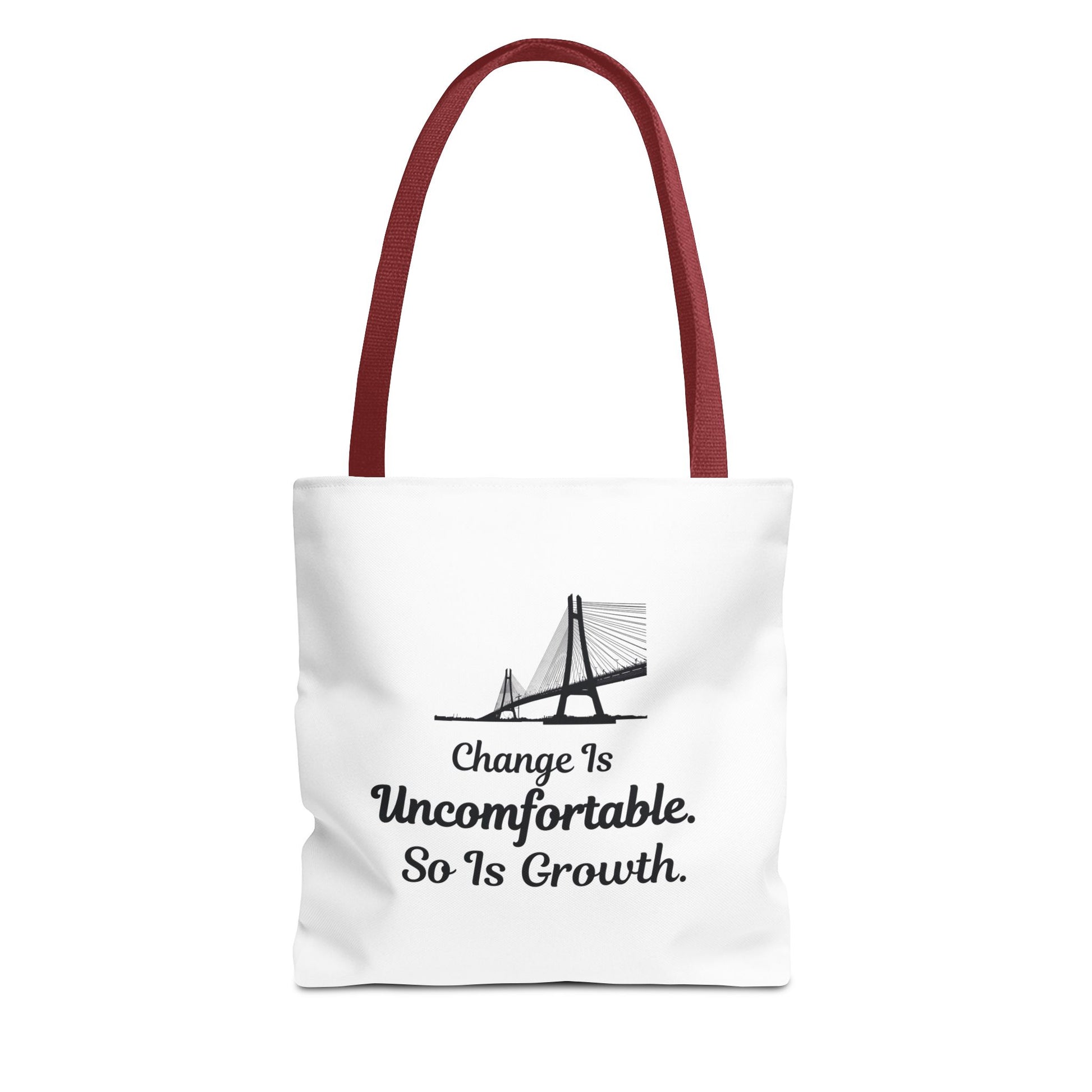 White tote bag with red handle, featuring the text 'Change Is Uncomfortable. So Is Growth' and a bridge graphic on a white background