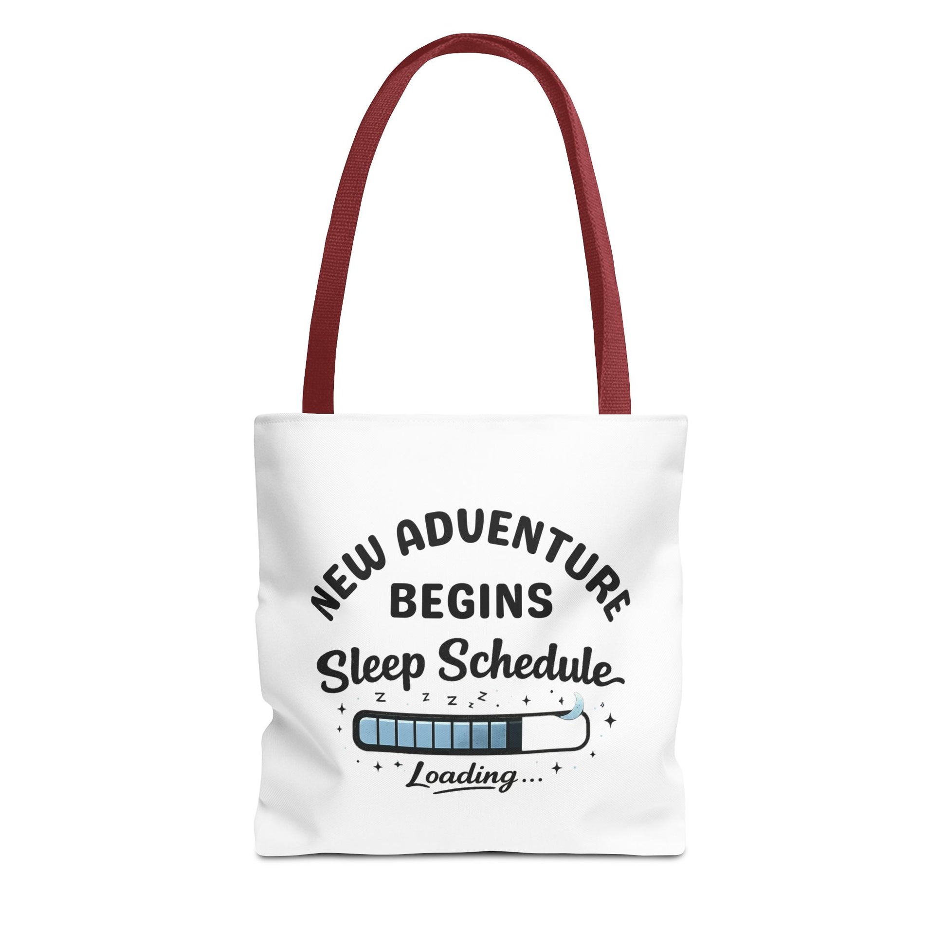 Tote bag with red handle and 'New Adventure Begins Sleep Schedule Loading' text on a white background