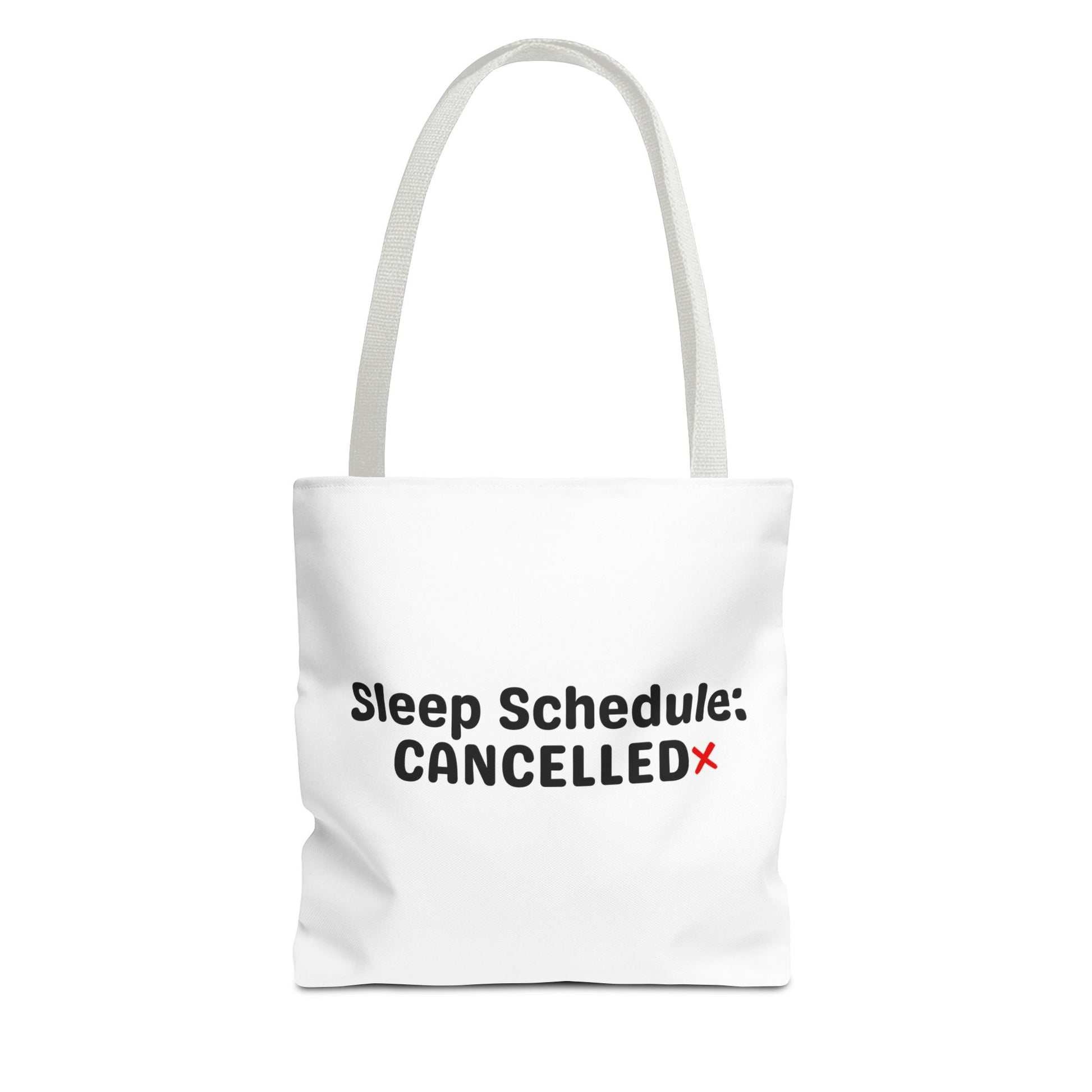 White tote bag with white handle and text 'Sleep Schedule: Cancelled' on a white background