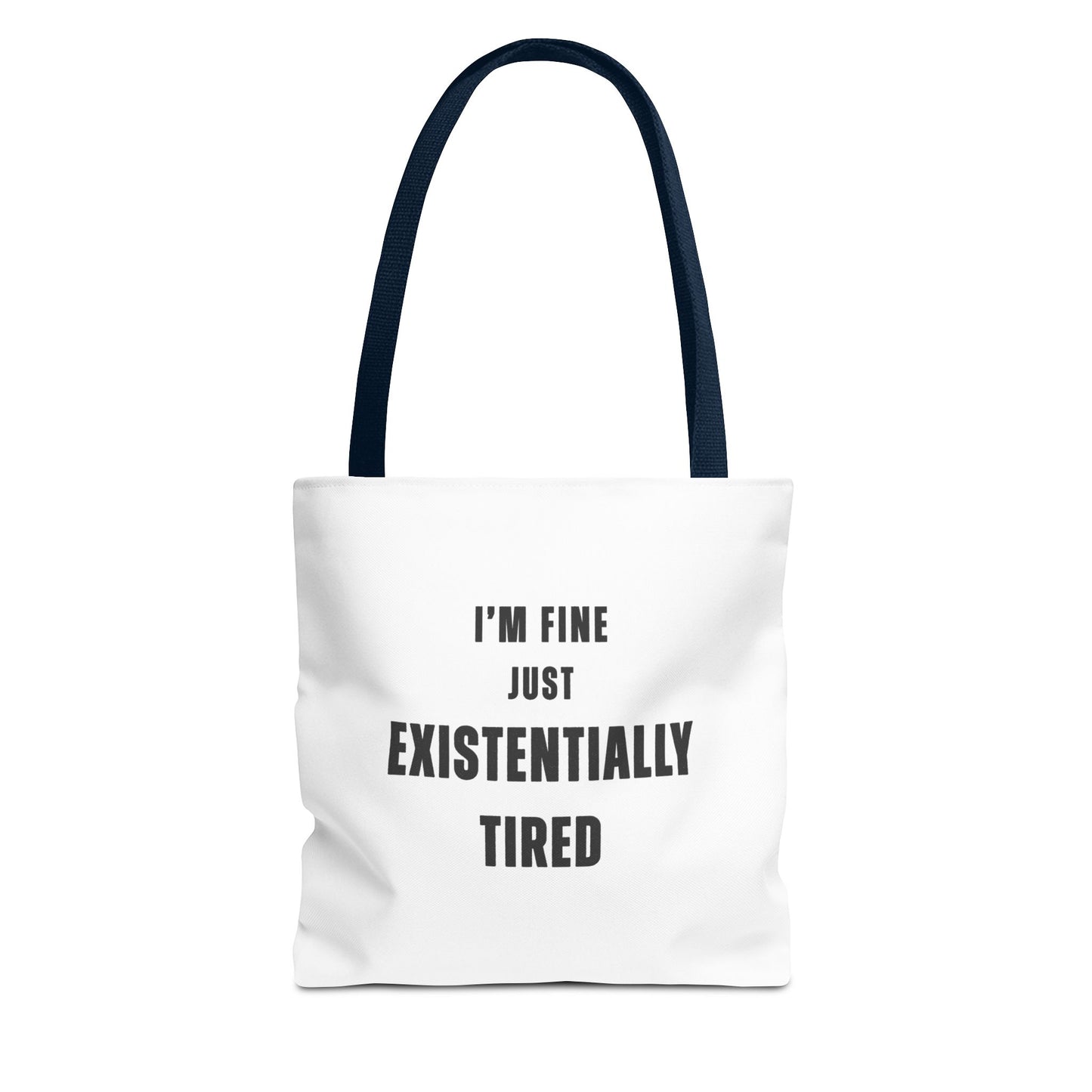 White tote bag with navy handles and text 'I’m fine. Just existentially tired.' on a white background