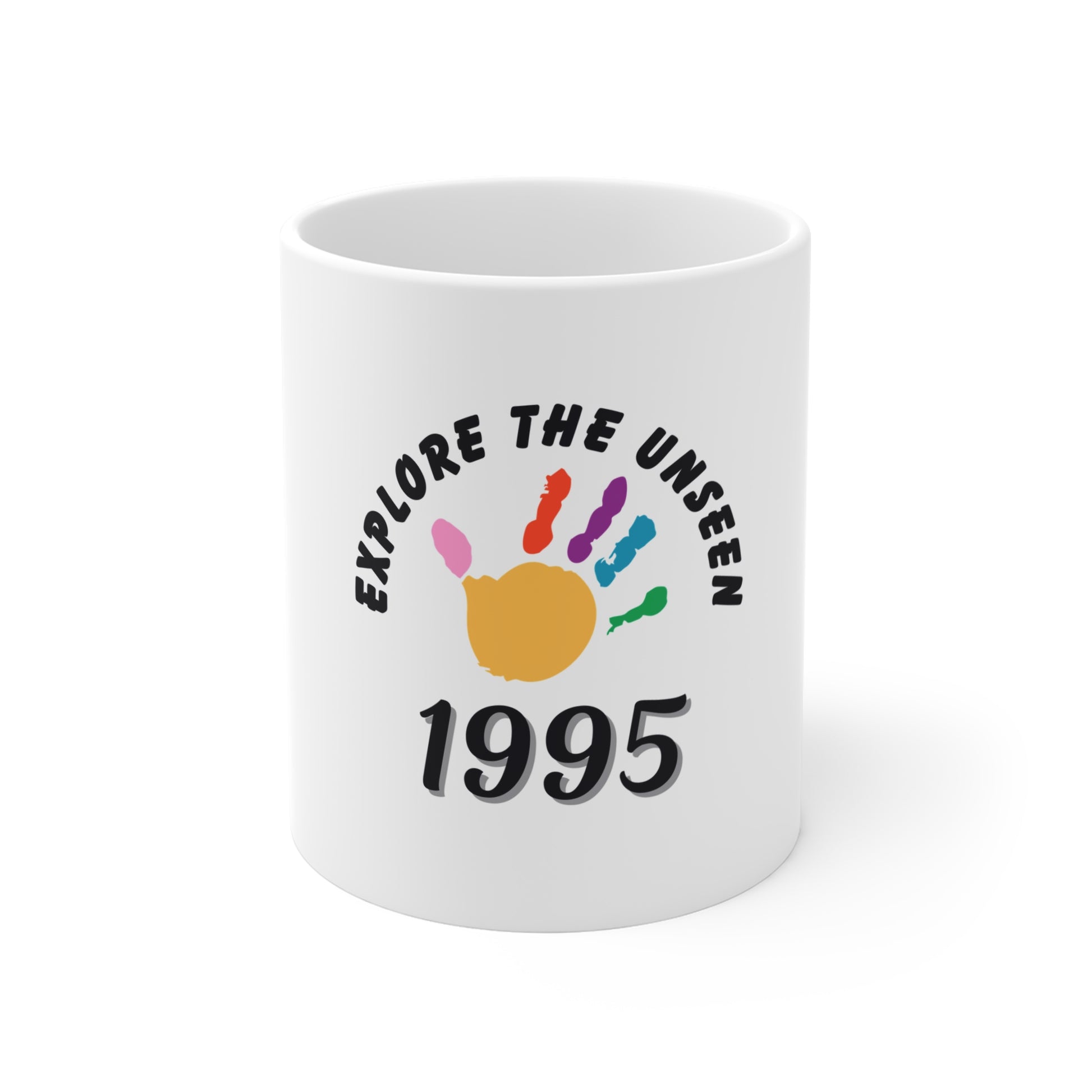 White mug with text 'Explore the Unseen 1995' on a white background