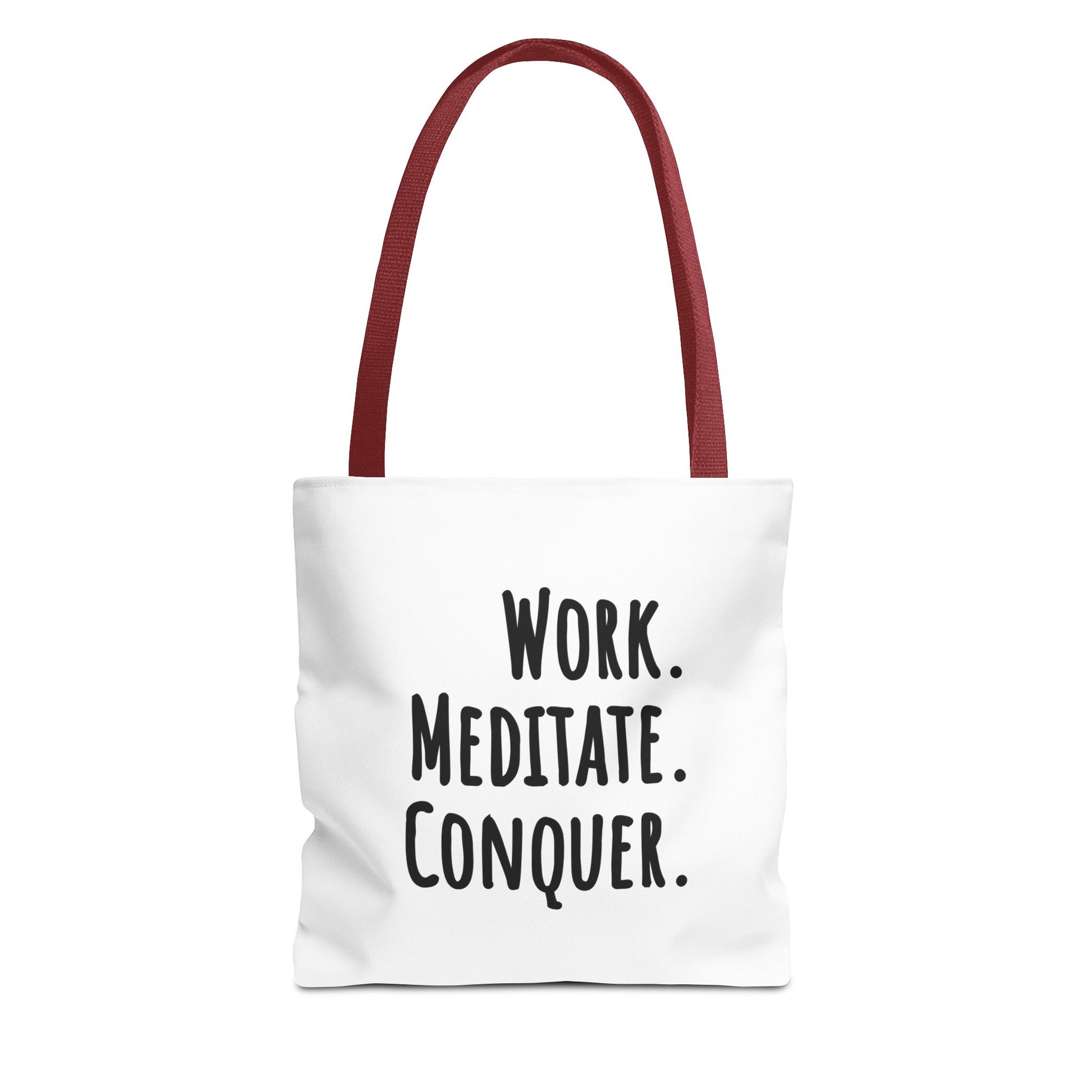 Tote bag with red handle and text 'Work. Meditate. Conquer.' on a white background