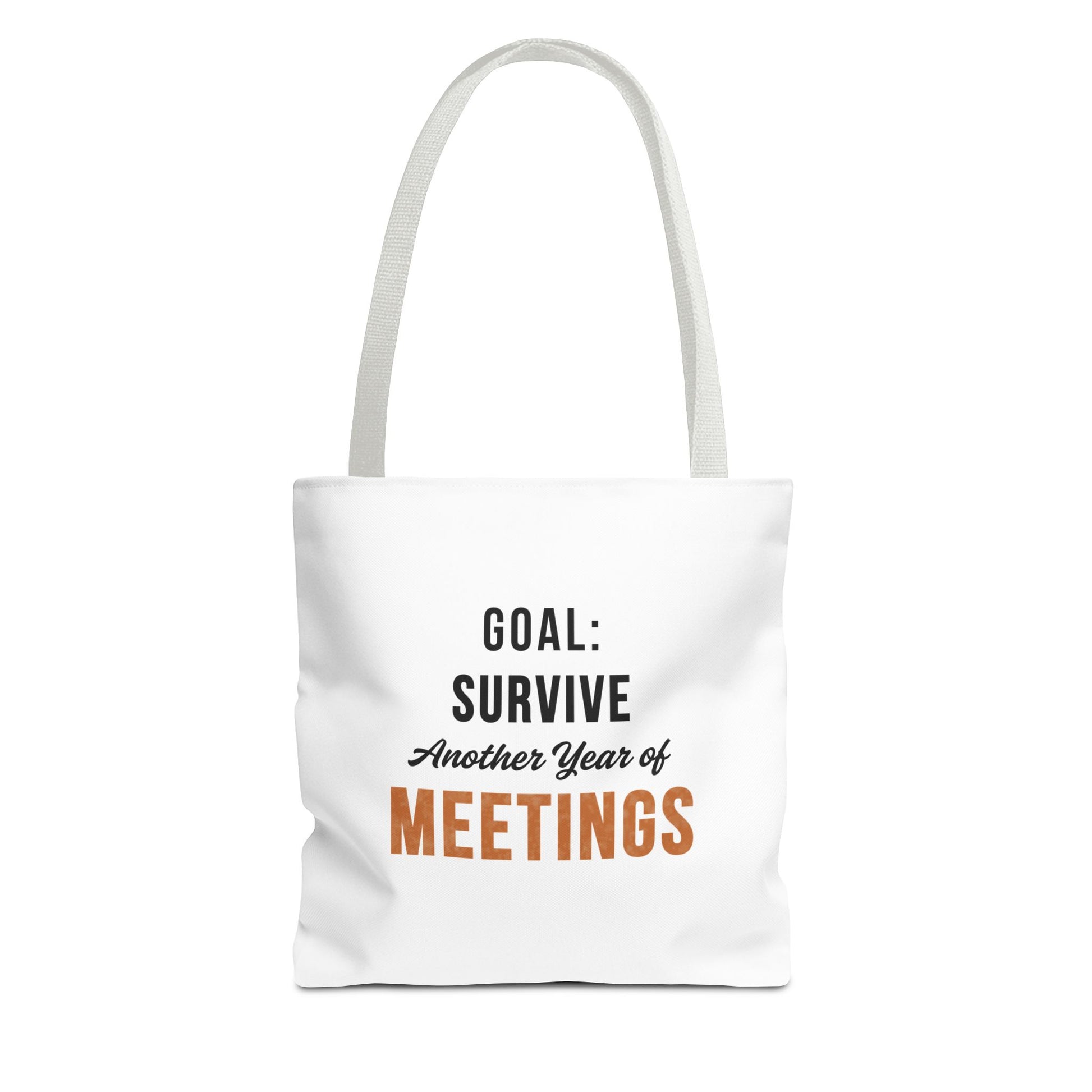 Tote bag with white handles and text 'Goal: Survive Another Year of Meetings' on a white background