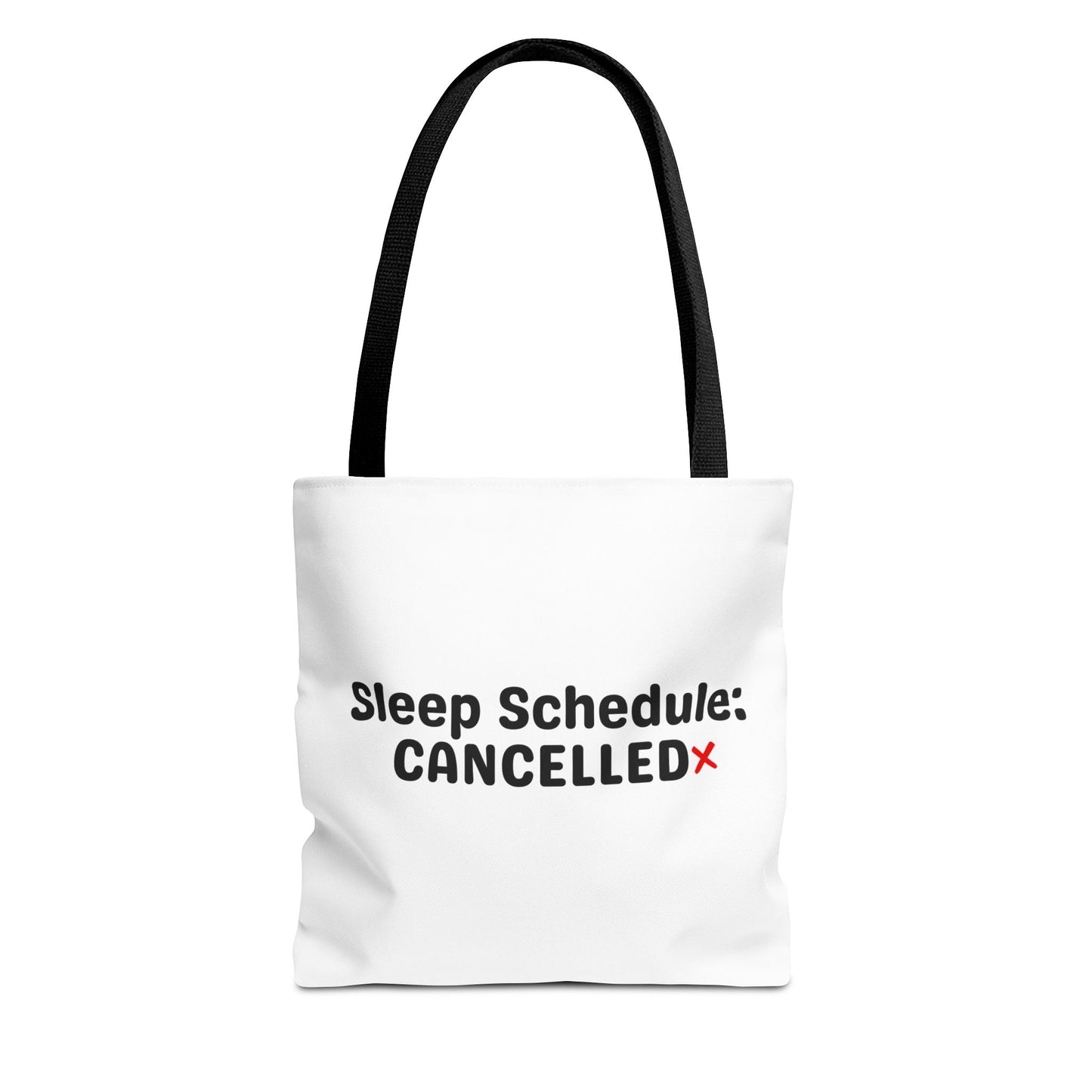 White tote bag with black handle and text 'Sleep Schedule: Cancelled' on a white background