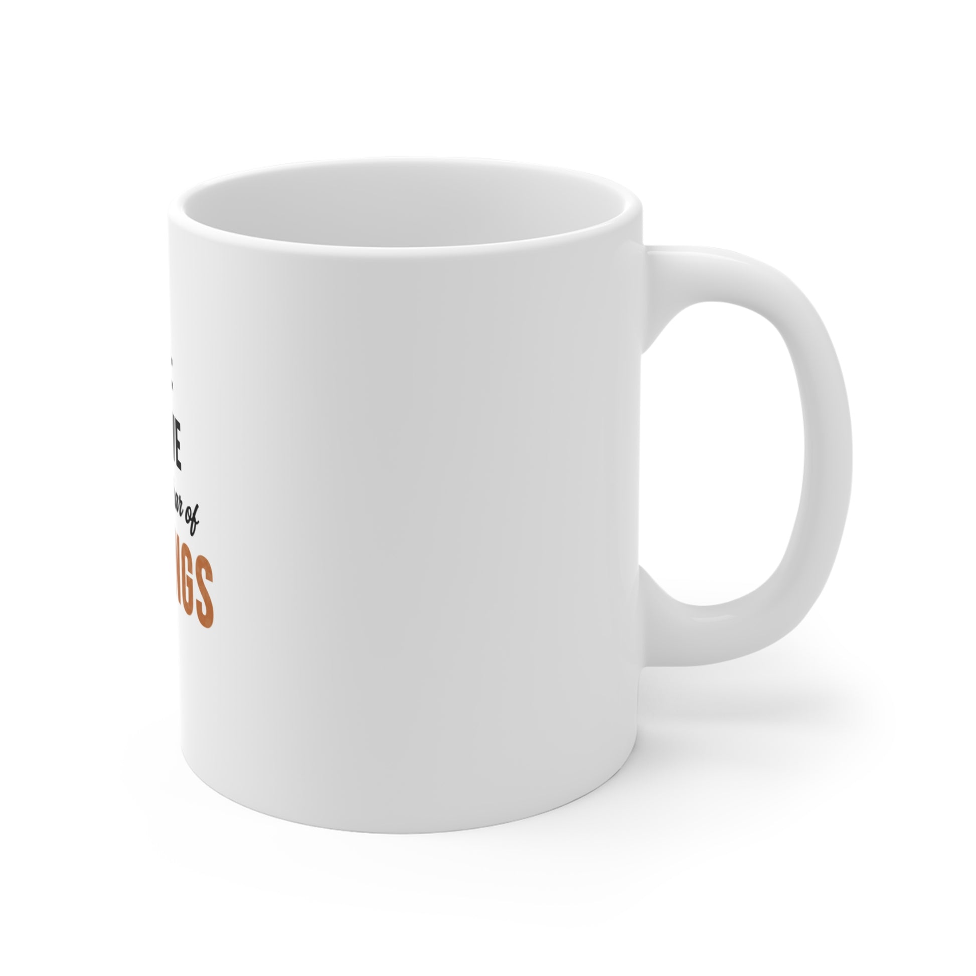 Right side view of a white mug with text 'Goal: Survive Another Year of Meetings' on a white background