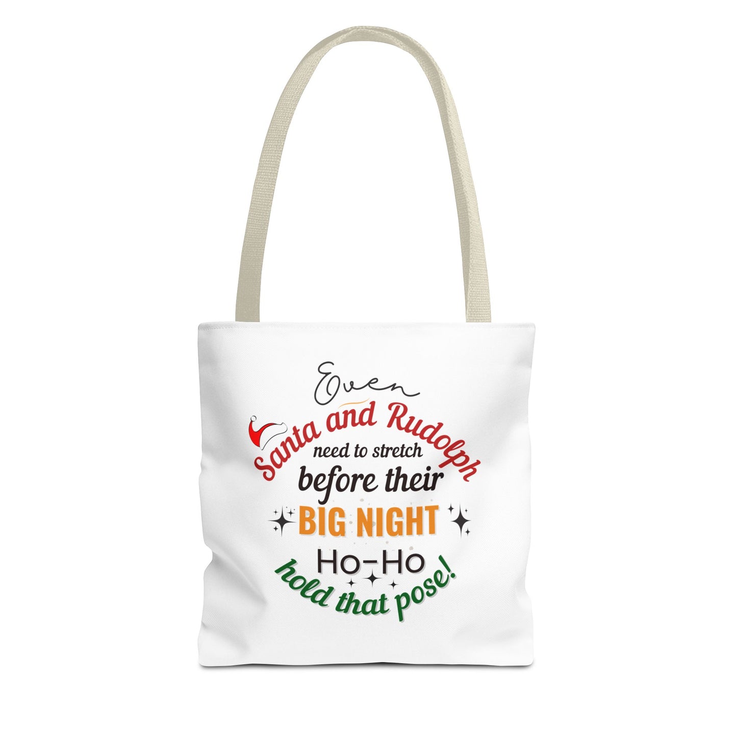 White tote bag with beige handle and text 'Event Santa & Rudolph Need to Stretch Before their Big Night. Ho-Ho-Hold That Pose!' on a white background