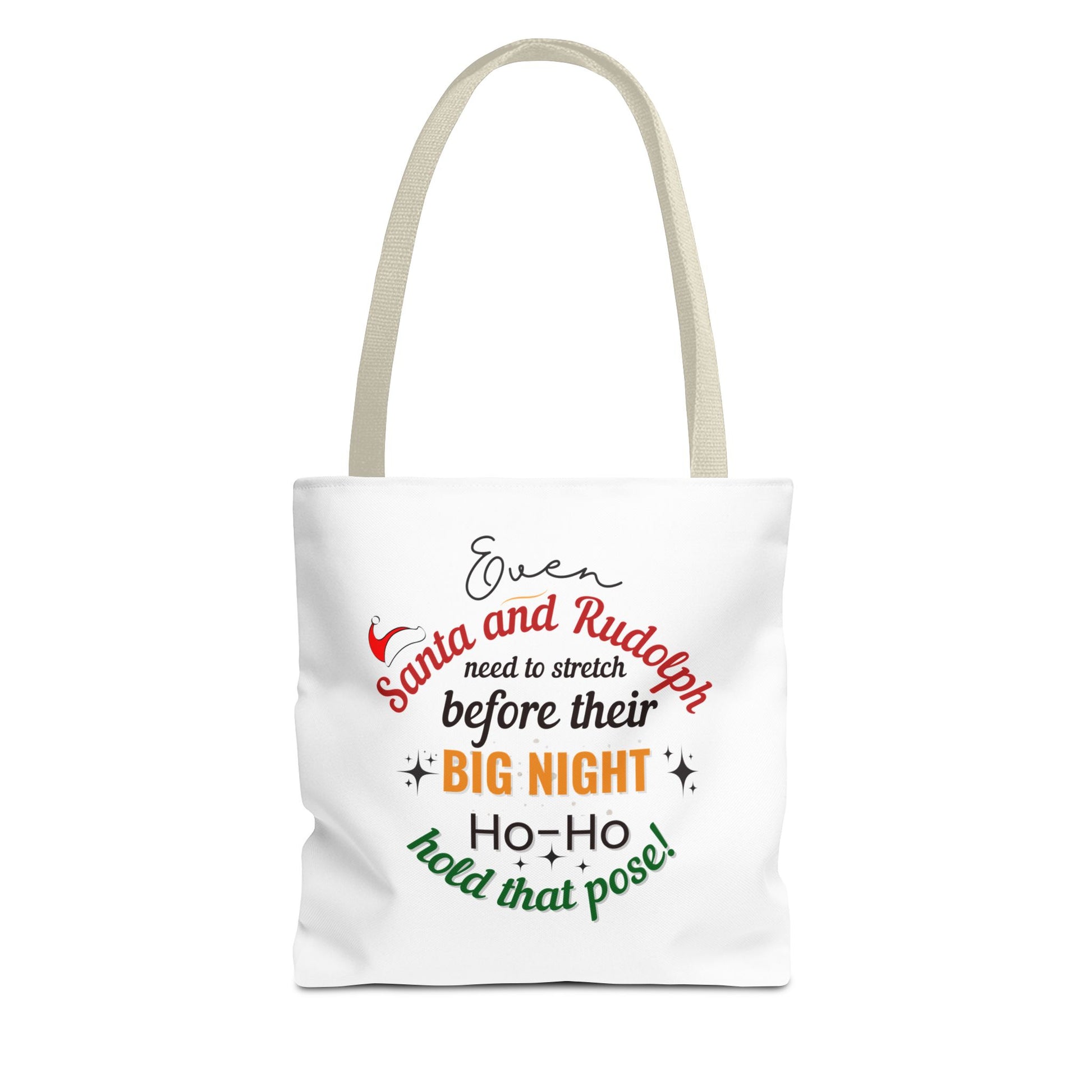 White tote bag with beige handle and text 'Event Santa & Rudolph Need to Stretch Before their Big Night. Ho-Ho-Hold That Pose!' on a white background