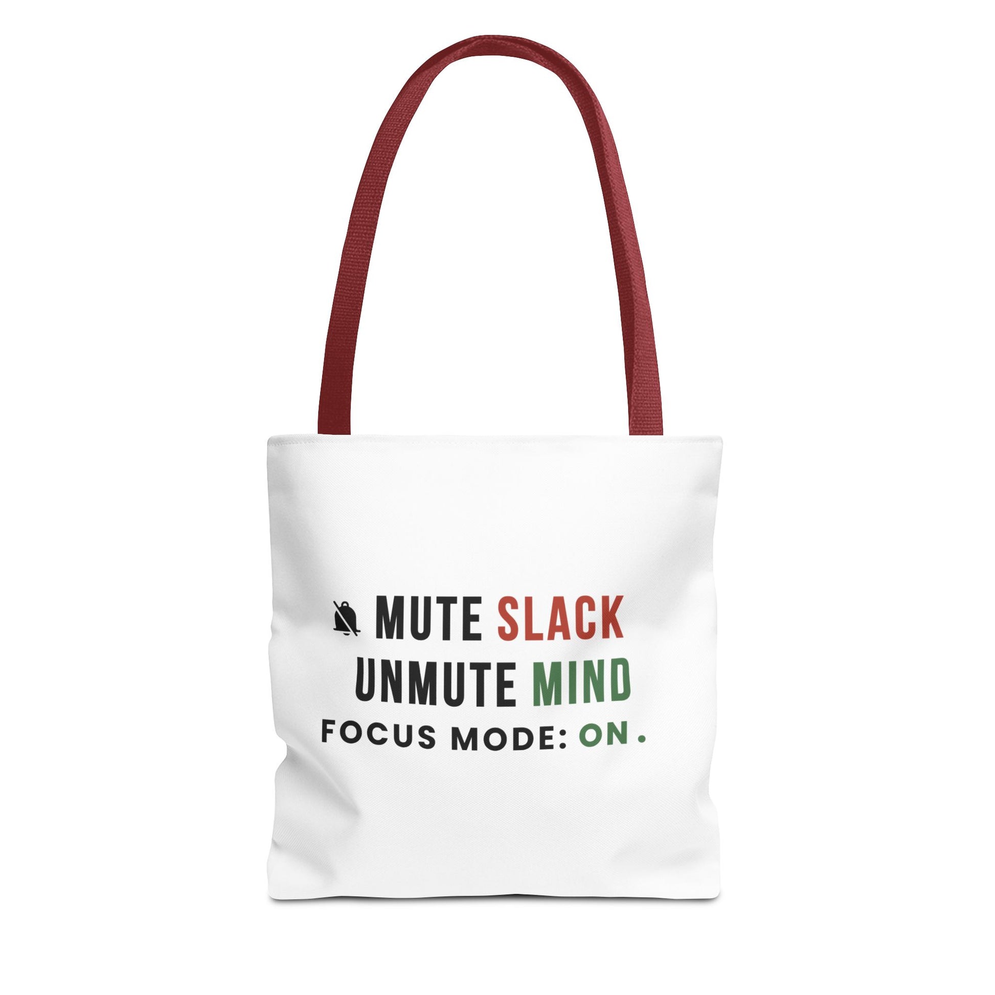 Tote bag with red handles and text 'Mute Slack, Unmute Mind. Focus Mode: On' on a white background