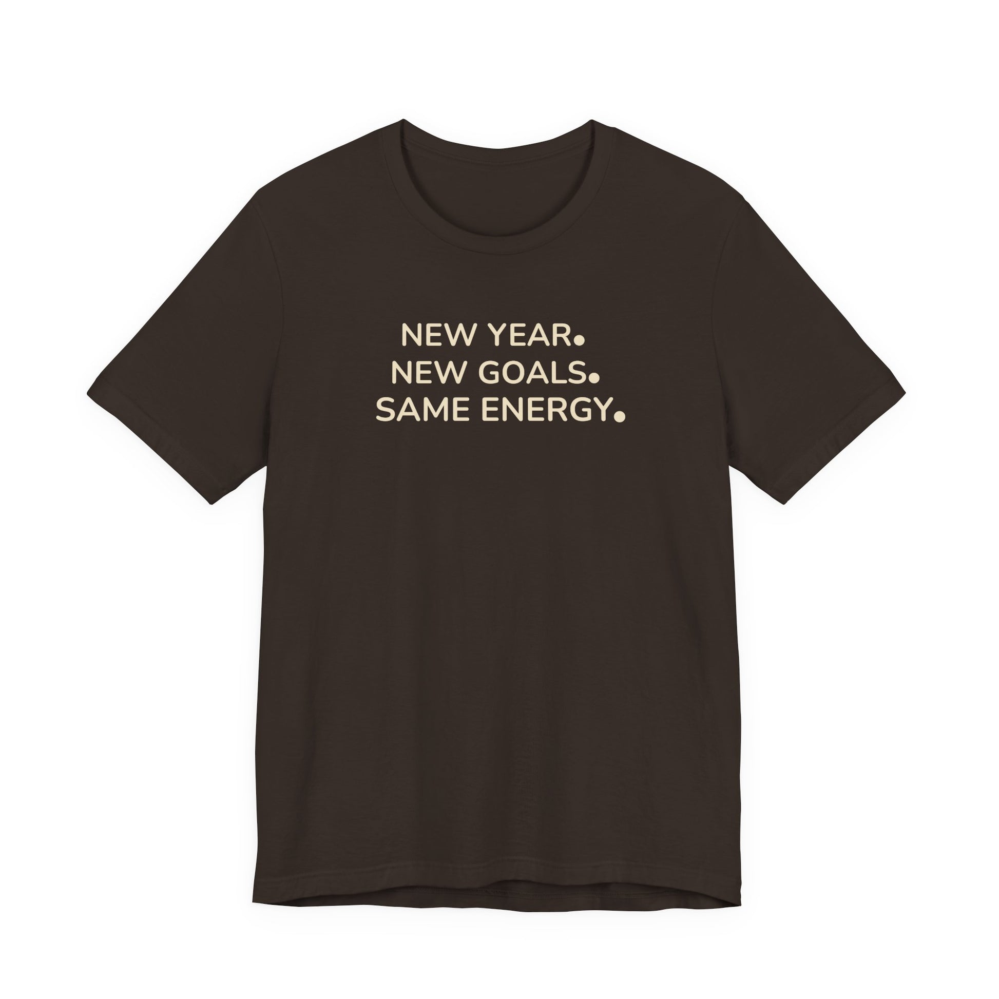 Brown t-shirt with white text 'NEW YEAR. NEW GOALS. SAME ENERGY.' on a white background