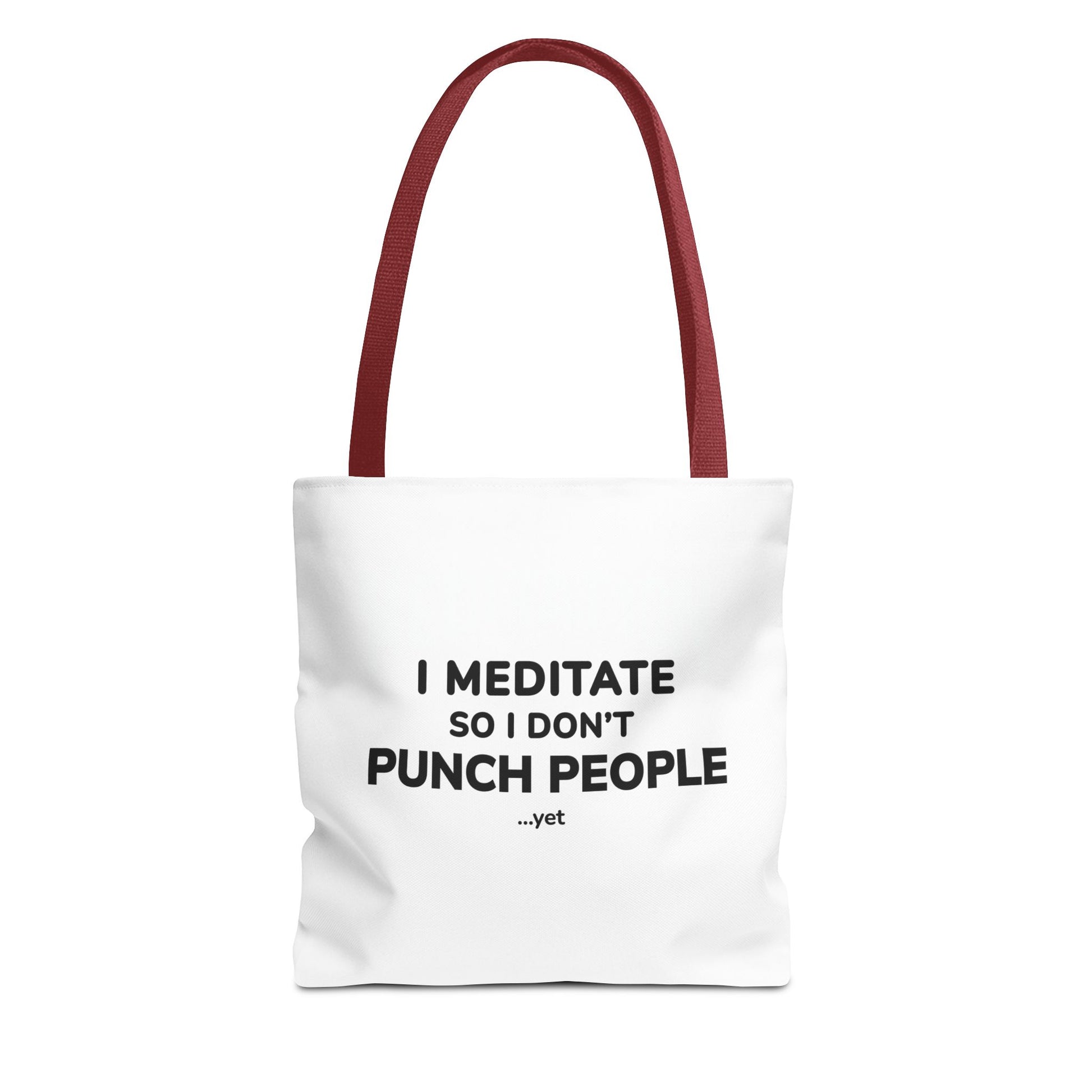 White tote bag with red handles and text 'I Meditate So I Don’t Punch People...yet' on a white background