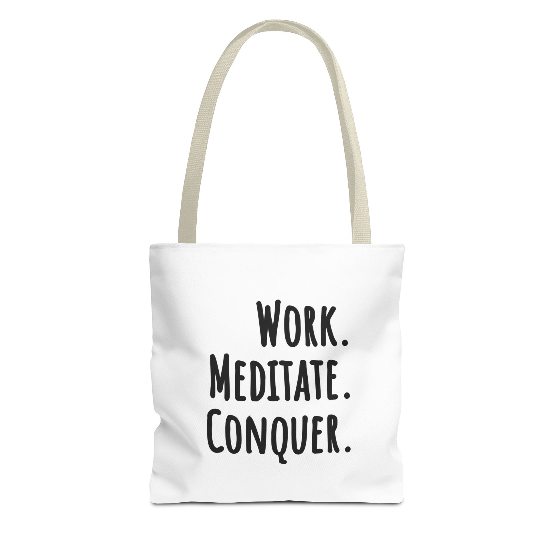 Tote bag with beige handle and text 'Work. Meditate. Conquer.' on a white background