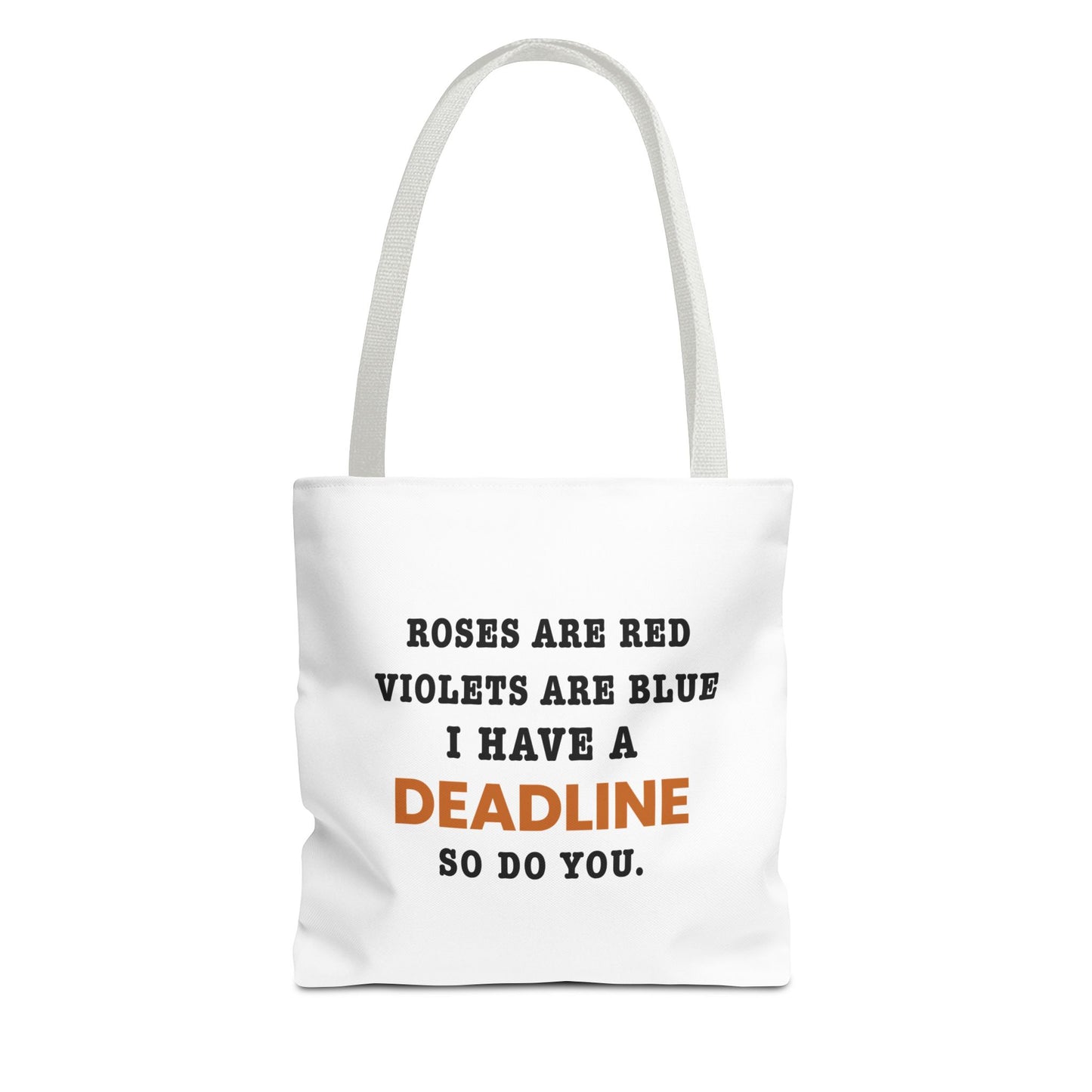 Tote bag with white handles and text 'Roes are red, violets are blue. I have a deadline so you do' on a white background