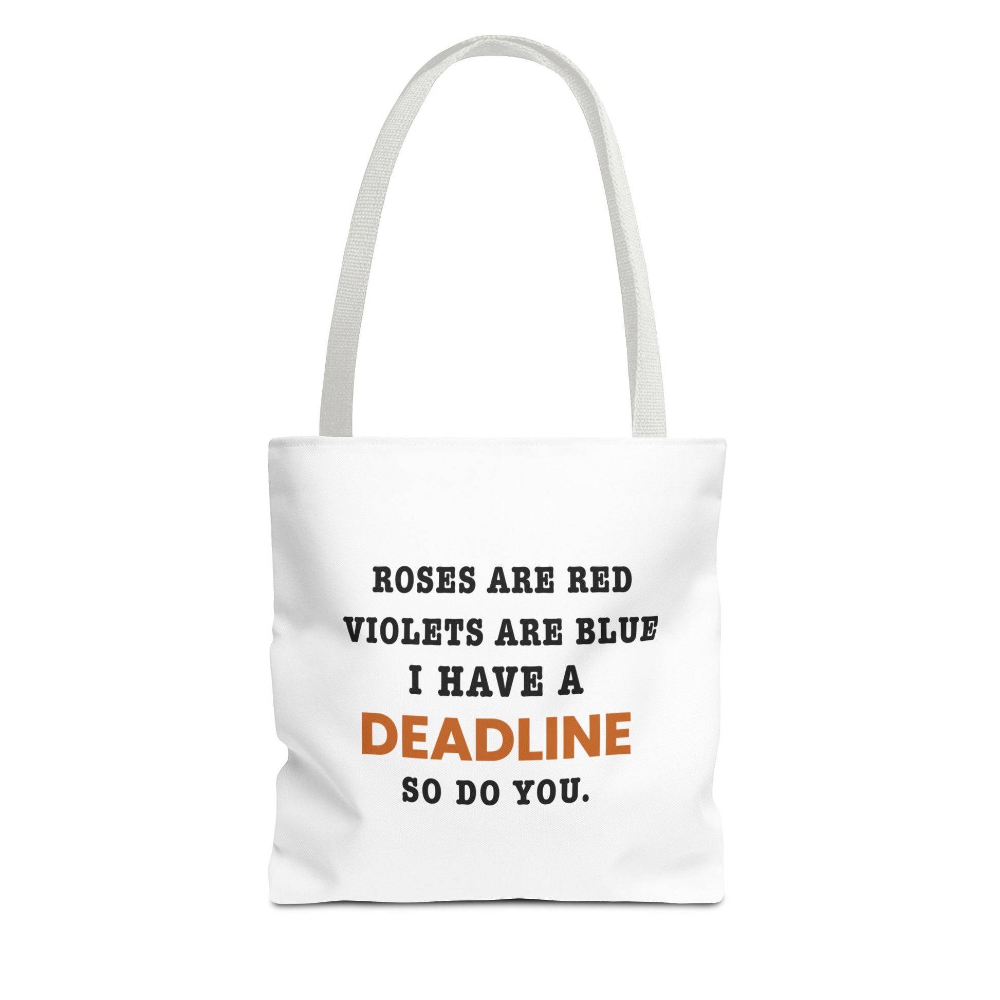 Tote bag with white handles and text 'Roes are red, violets are blue. I have a deadline so you do' on a white background