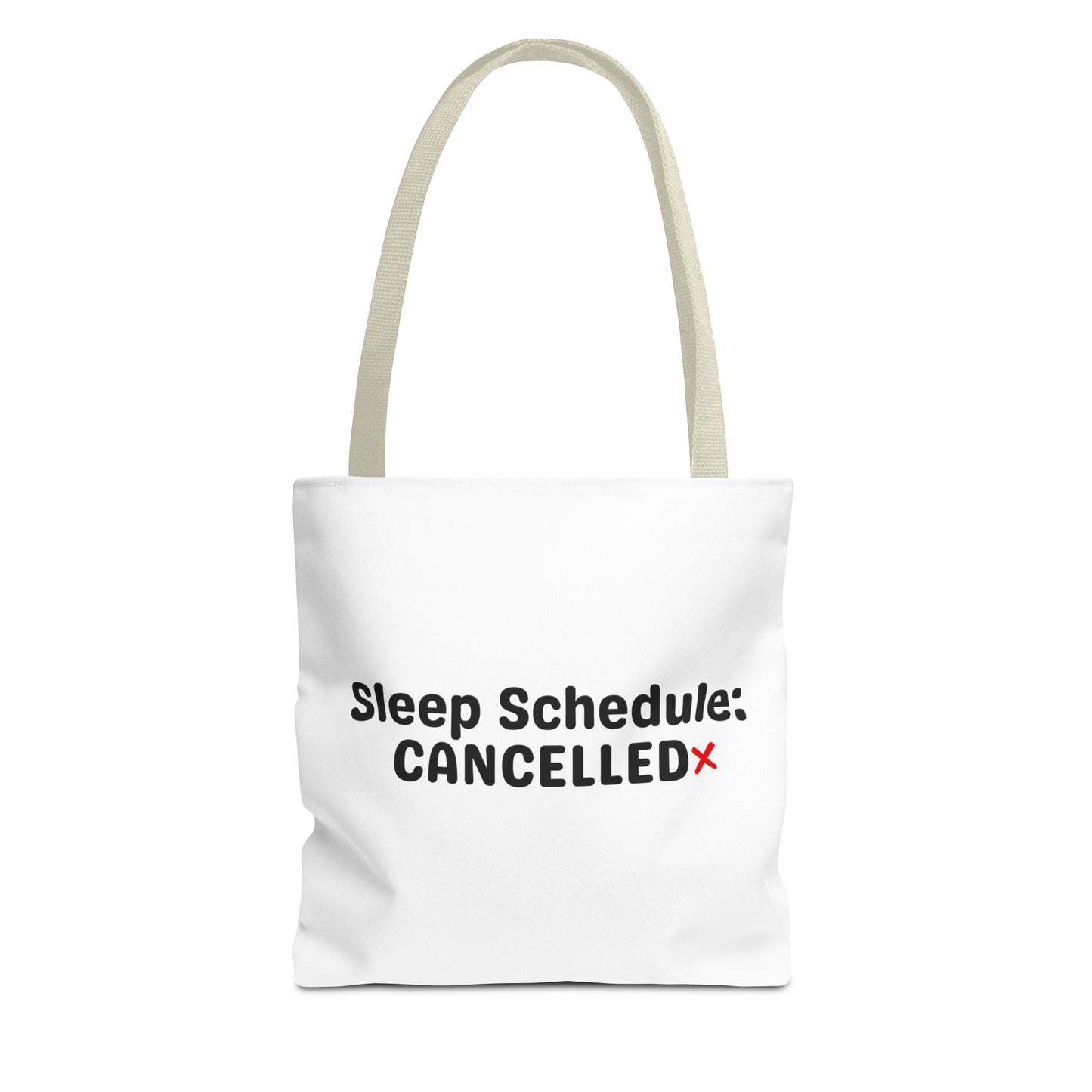White tote bag with beige handle and text 'Sleep Schedule: Cancelled' on a white background