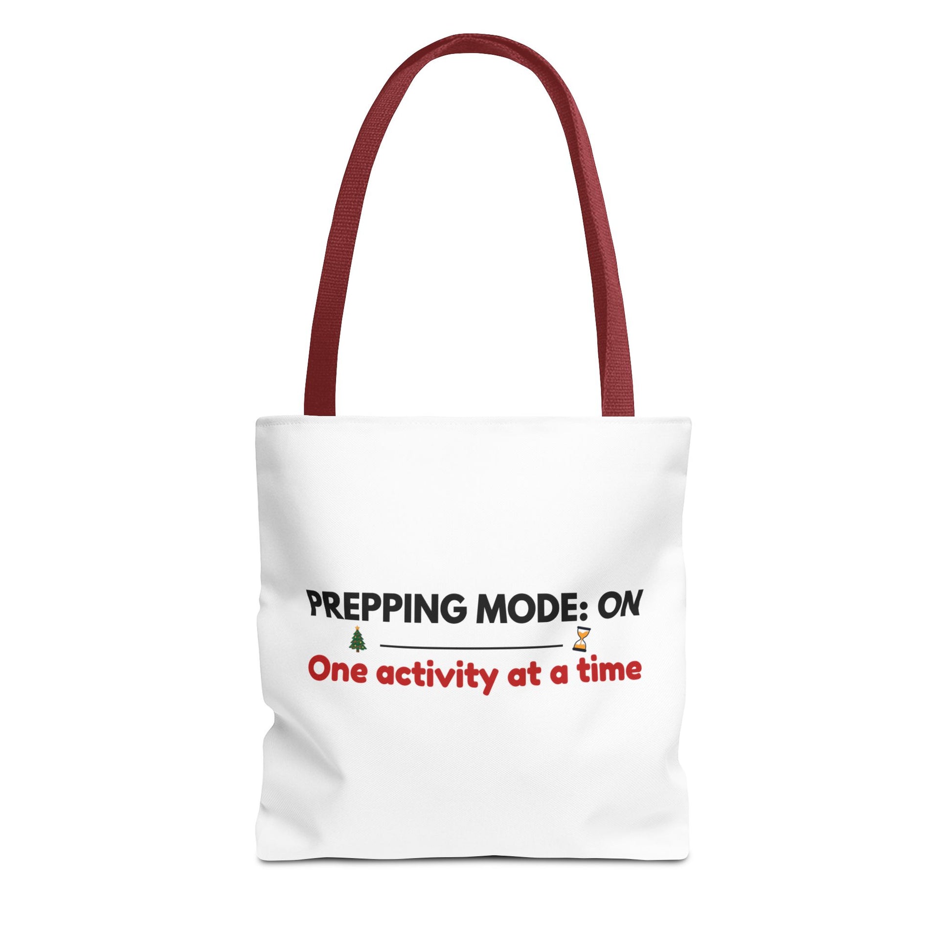 Tote bag with red handle and text 'Prepping Mode: On One Activity at a Time' on a white background