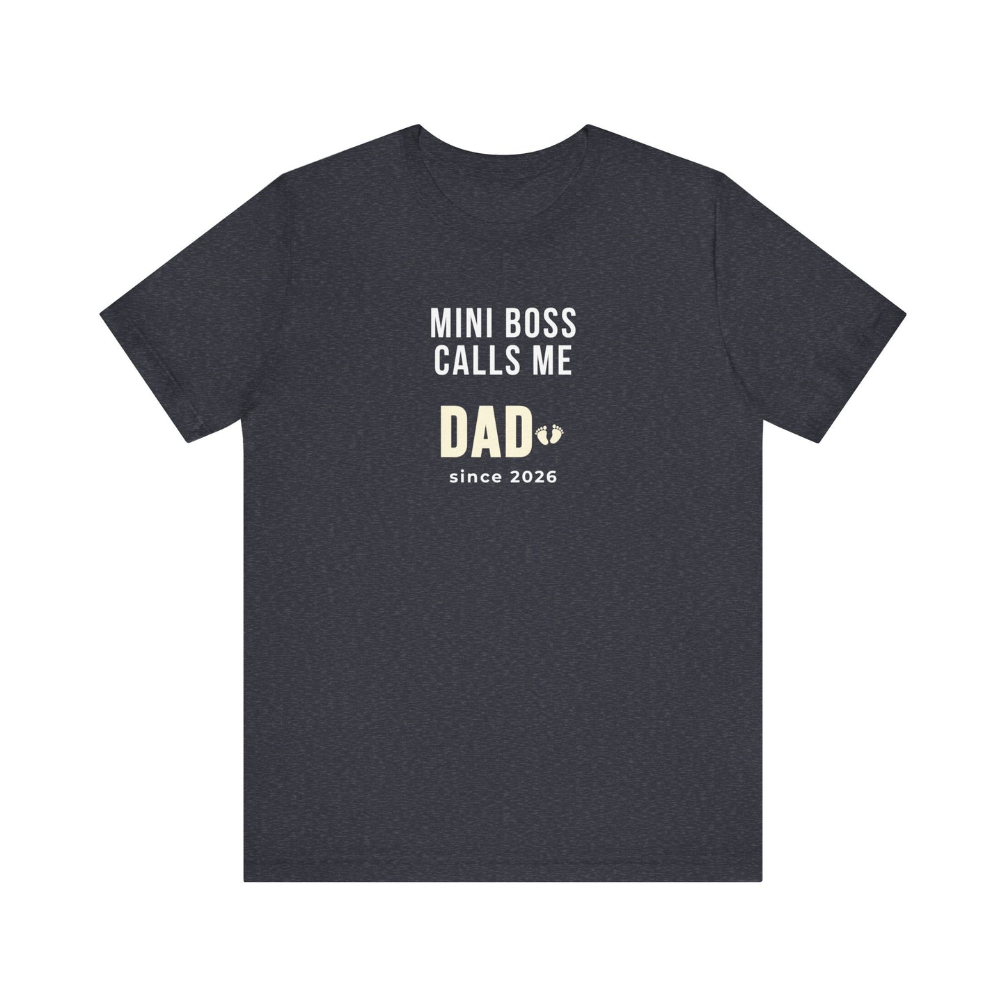 Heather navy t-shirt with white text 'Mini Boss Calls Me Dad – since 2026' on a white background