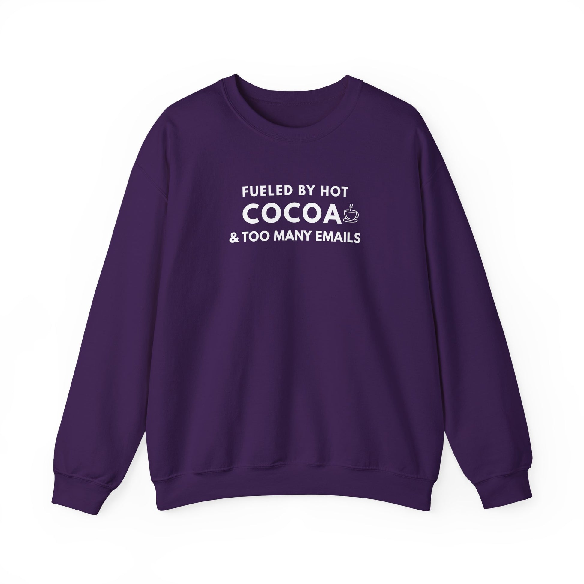 Purple sweatshirt with text 'Fueled by hot cocoa & too many emails' on a white background
