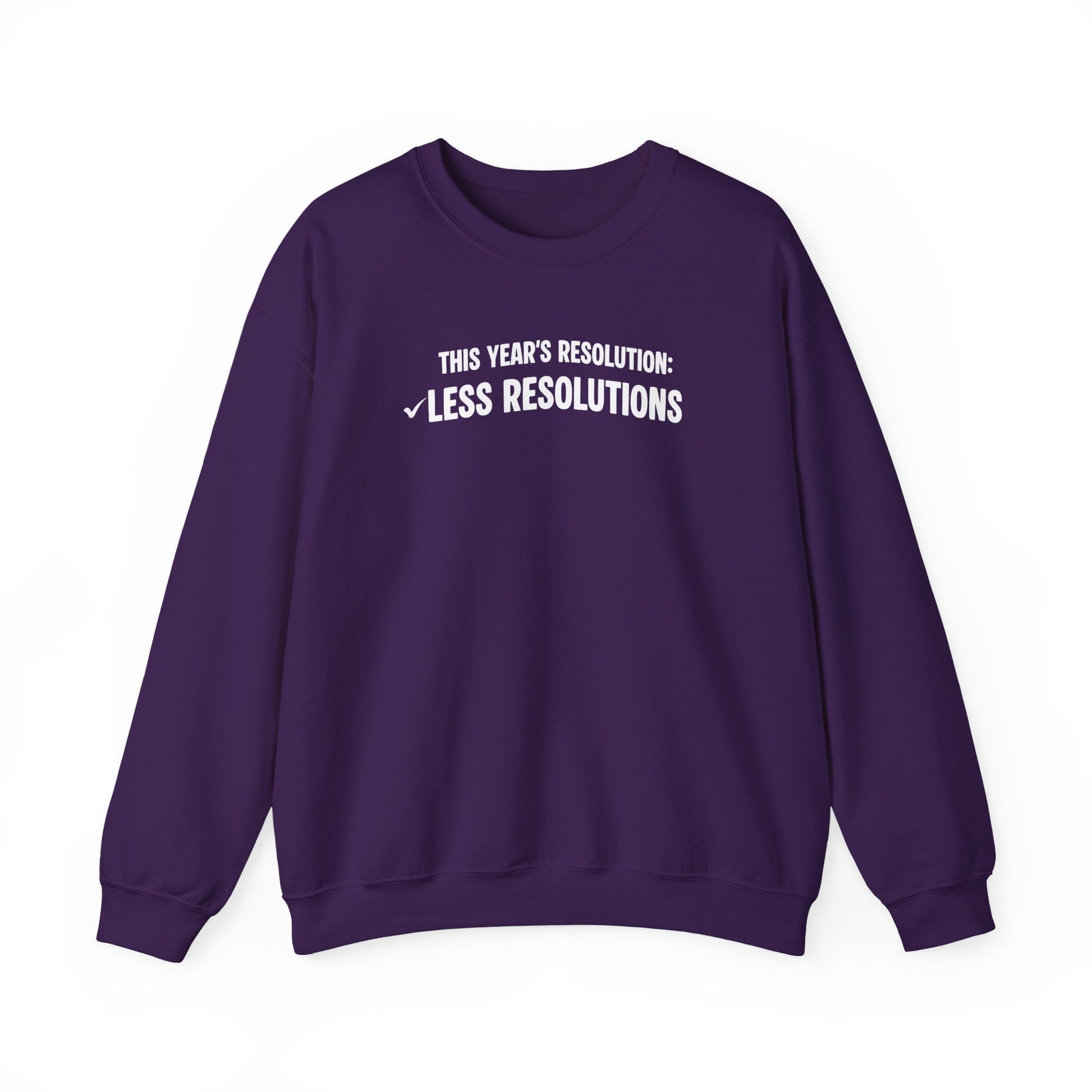 Purple sweatshirt with white text 'This year’s resolution: Less resolutions.' on a white background