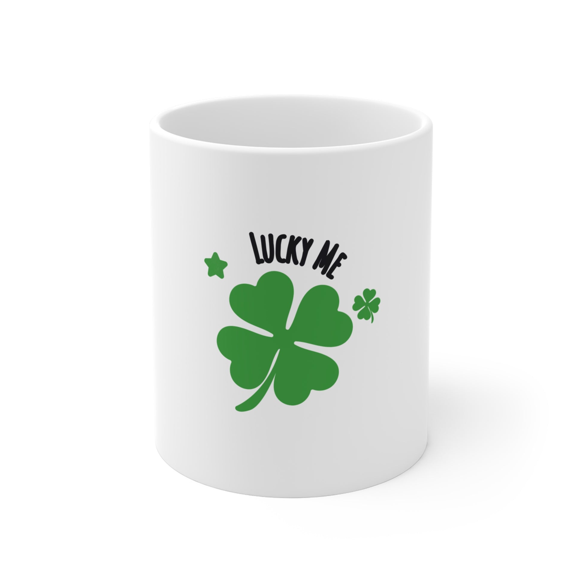 White mug with green four-leaf clover and 'Lucky Me' text on a white background