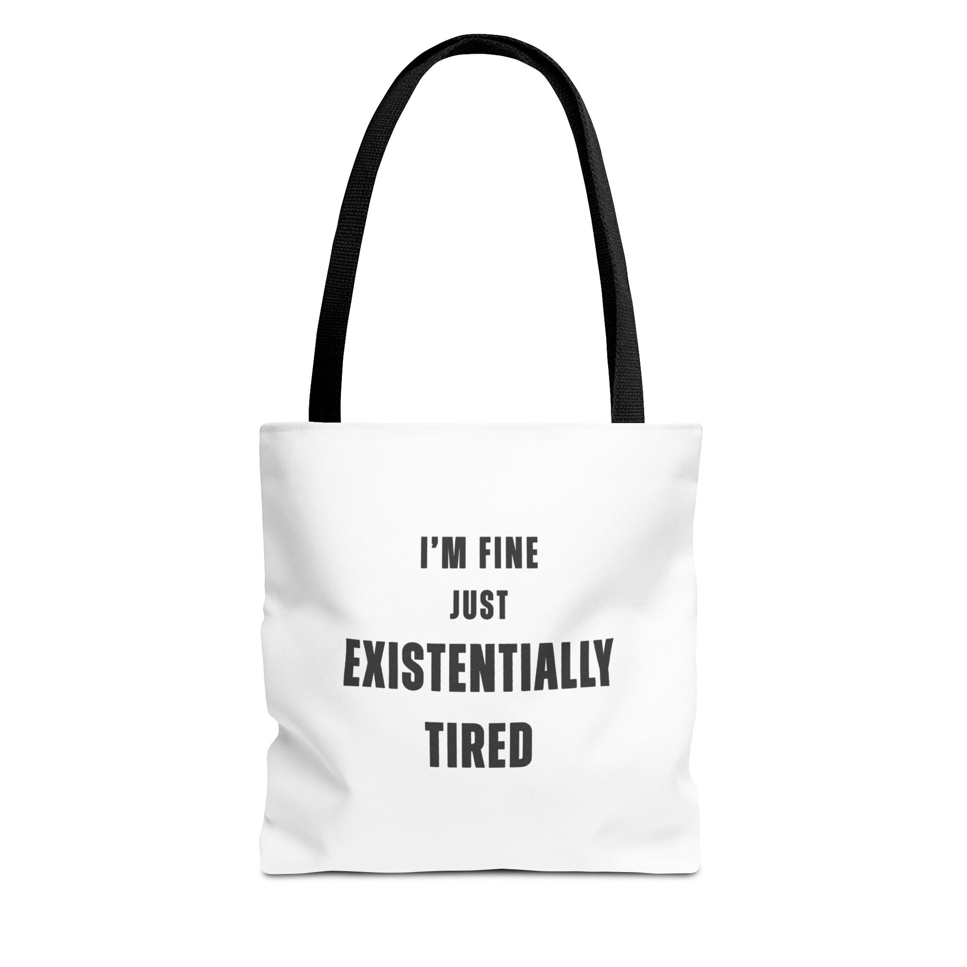 White tote bag with black handles and text 'I’m fine. Just existentially tired.' on a white background