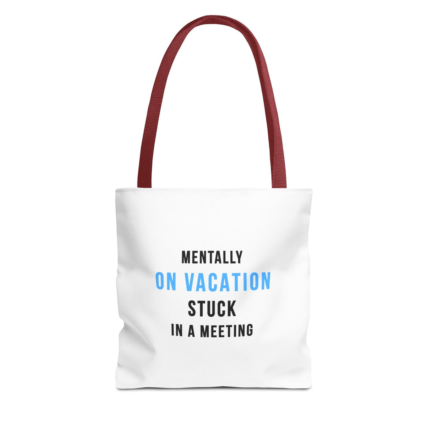 White tote bag with red handles featuring the text 'Mentally on Vacation. Stuck in A Meeting' on a white background