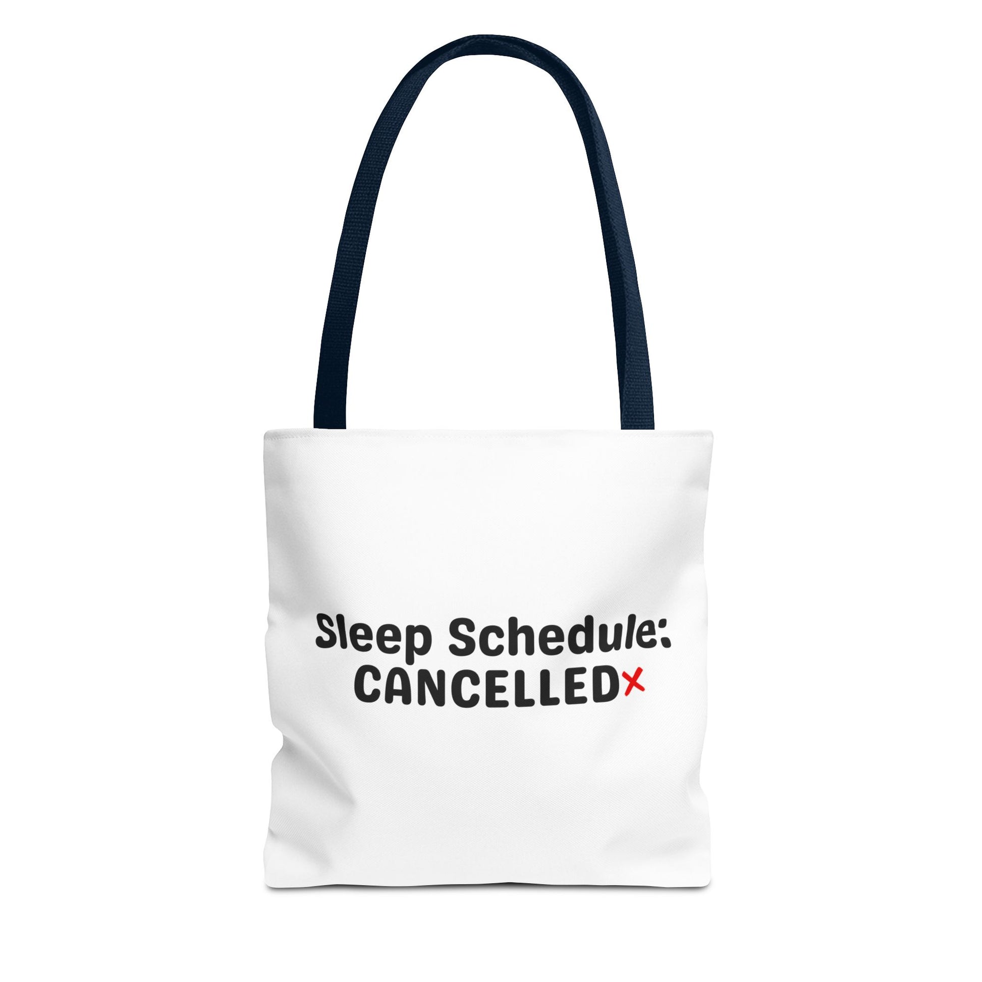 White tote bag with navy handle and text 'Sleep Schedule: Cancelled' on a white background