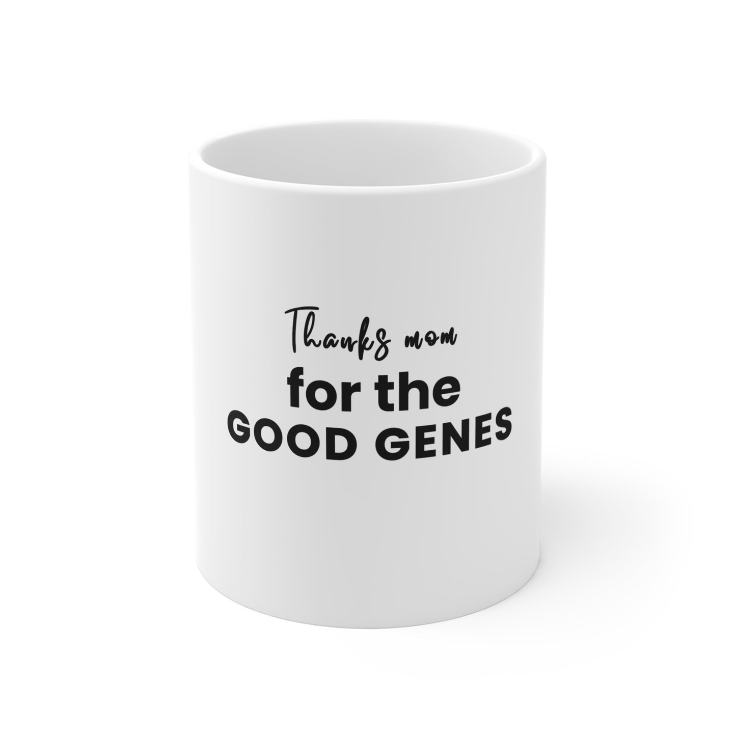 White mug with text 'Thanks mom for the good genes' on a white background